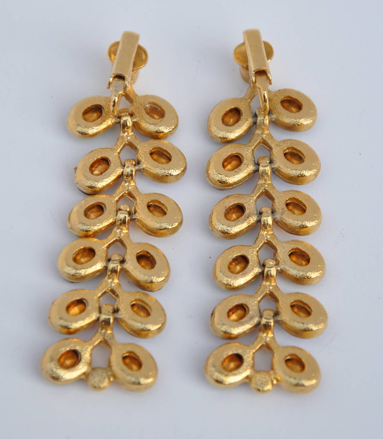 These wonderfully colorful gilded gold vermeil finish accented with multi-colors "Leaf" drop earrings measures 2 1/2" in length, 7/16 in width and 2/8" in depth.