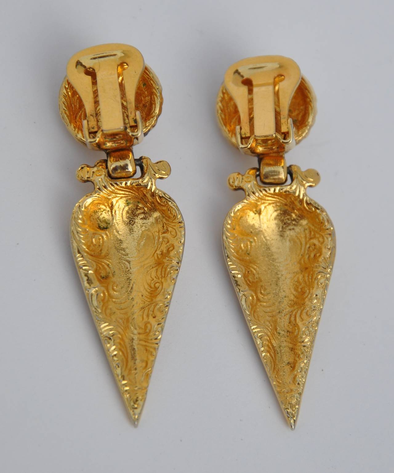 These pair of gilded gold vermeil finish drop earrings measures 2 1/8" in height, width is 5/8", depth is 2/8".