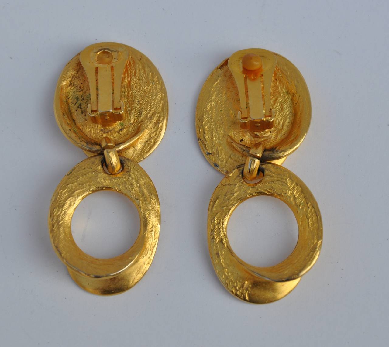 These wonderful gilded gold vermeil drop earrings measures 2 1/4" in length, 1" in width and 2/8" in depth.