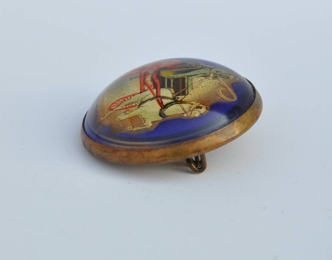       Wonderfully detailed brass-frame "Horse & Carriage" brooch measures 1 1/2" in circumference and 1/2" in depth.