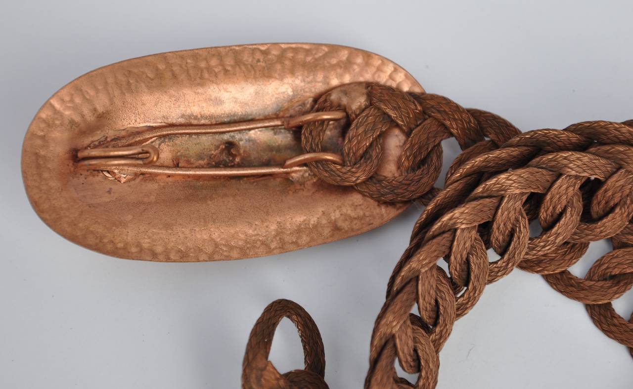        Renoir's wonderfully detailed copper multi chain link adjustable belt can simply be adjusted by hooking into one of many chain links. This wonderful belt can be worn draping on the hips or as a classic belt. The total length measures 38 1/2