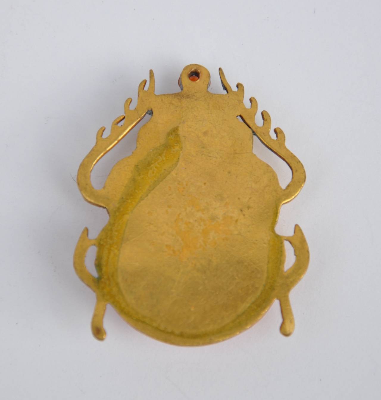This wonderfully detailed gold with red enamel styled "Scarab" pendant measures 1 3/4" in height, width is 1 1/2", depth is 2/8".