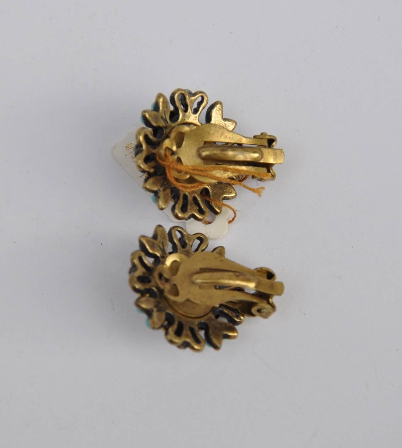 Michal Negria multi-color earrings measures 1" in height, 7/8" in width and 3/8" in depth. Earrings are signed on the backside.