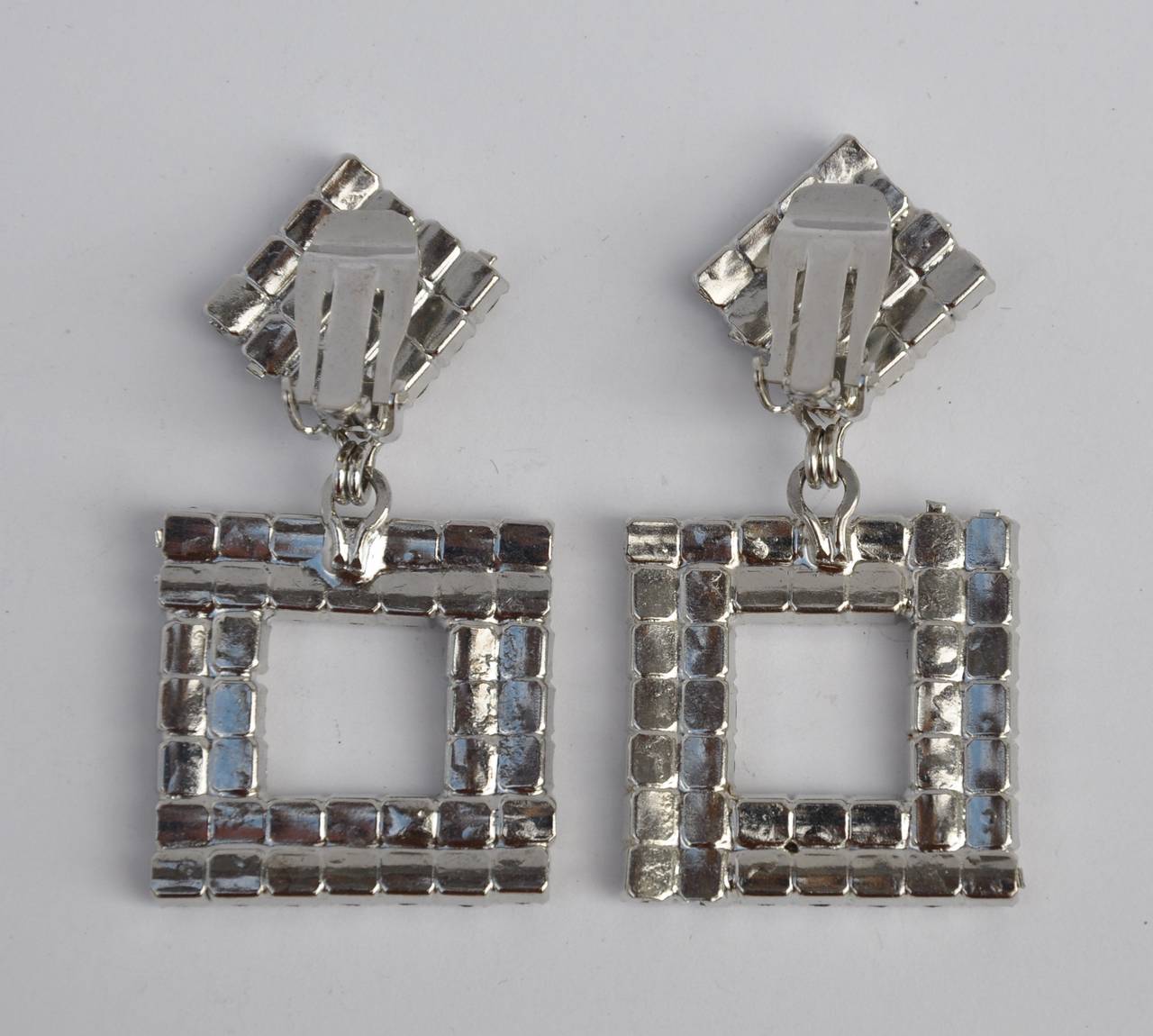 '80s' large multi-rhinestones with polished silver hardware drop ear clips measures 2 6/8" in length, width is 1 2/8", depth is 1/8".