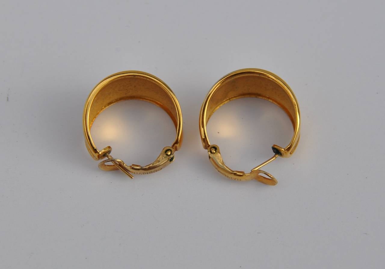 Napier's wonderful gilded gold wide loop ear clips are signed on the interior. The ear clips measures 3/4" in circumference, width is 1/2".
