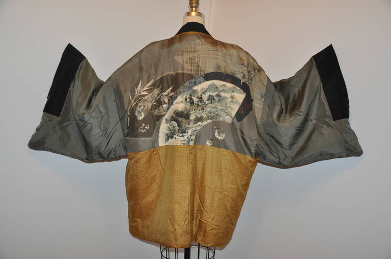 This rare and wonderfully detailed and well-made quilted Japanese silk kimono will keep you warm during those cold months. The exterior is a wheat-color with micro plaid print. The interior is in colors of taupe, wheat plaid and black silk