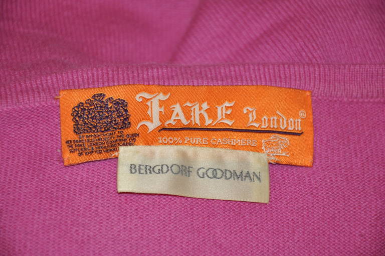 'Fake' of London, for Bergdorf Goodman 100% cashmere in bold fuchsia is accented with sequins in front of the tank.
   The front length measures 15 3/4