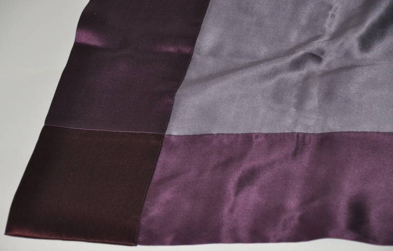 This wonderfully huge silk crepe de chine scarf of violet is detailed with a double-layer of plum silk crepe de chine measuring 4 1/2