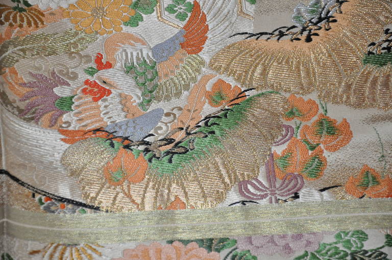 This wonderfully detailed Japanese texile hand-woven with metallic gold threads measures 26