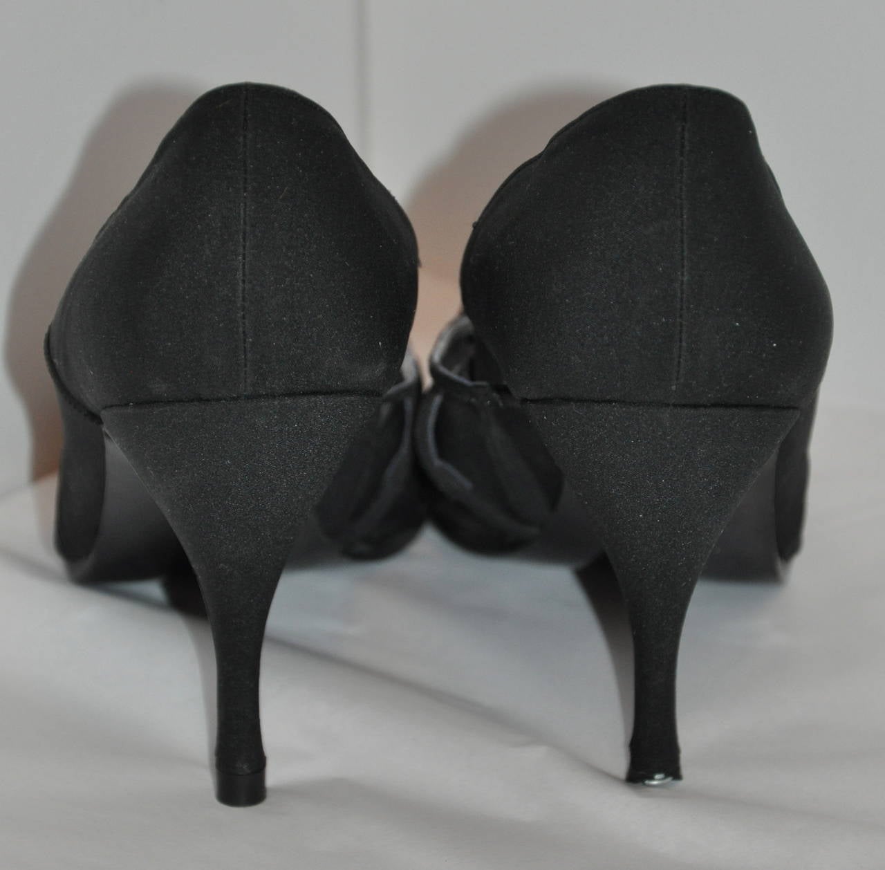 Susan Bennis Warren Edwards hand-made black silk satin evening pumps are sized 38.5/Italy, 8 1/2/American.
   Heels measures 3.75 in height.