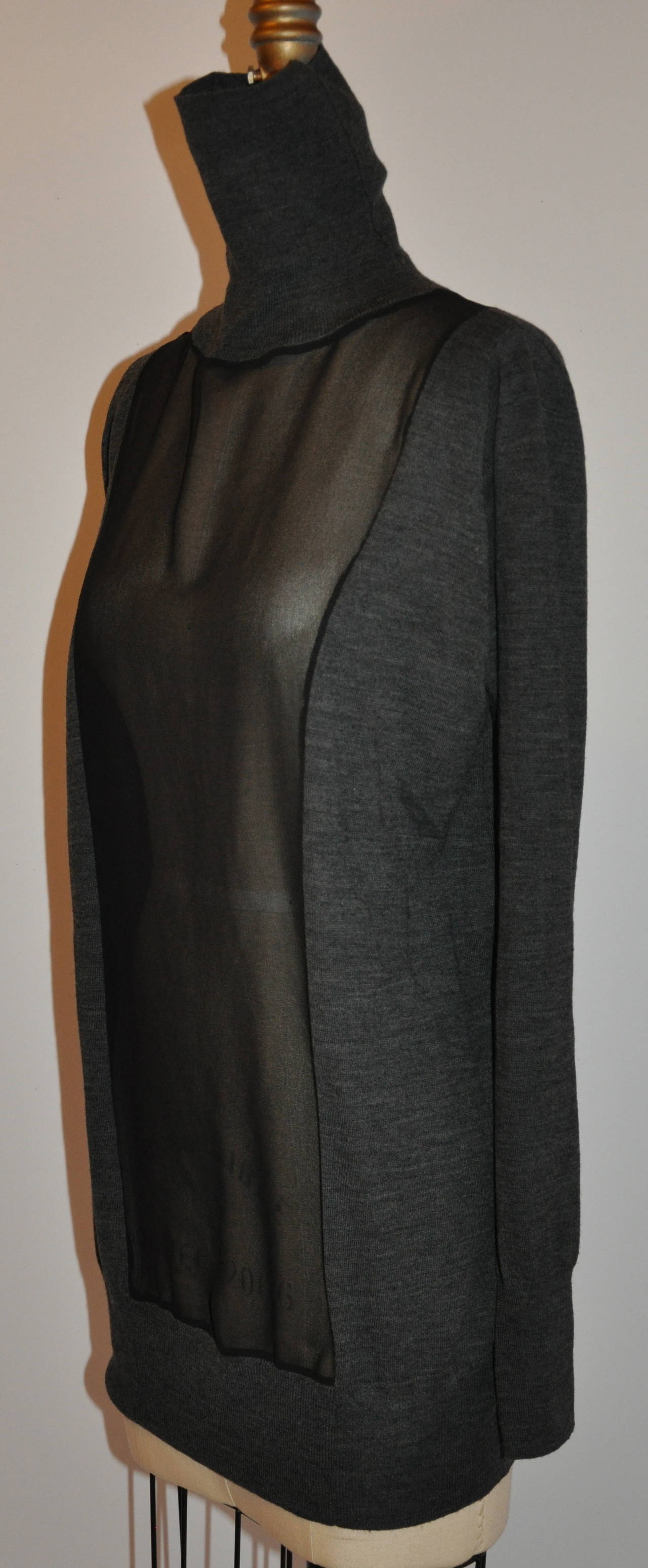 Anne Fontaine Charcoal merino wool is centered with sheer black. Soft merino wool turtleneck makes for sheer elegant. 
   Shoulder measures 15