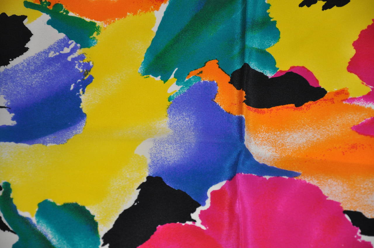 This wonderfully bold multi-color silk scarf from Saldariui measures 34" x 33", and finished with hand-rolled edges.