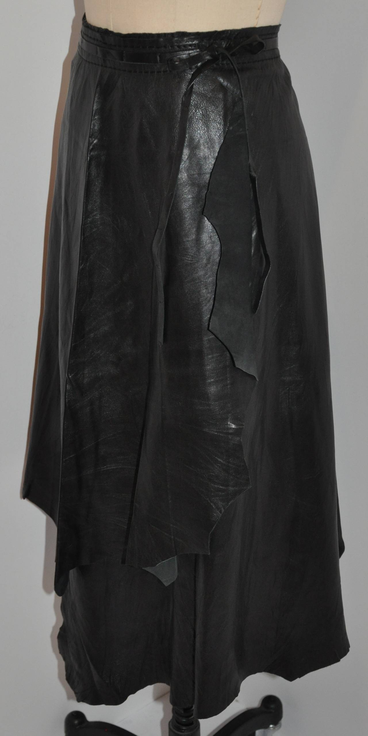 Pleid Sud Soft black lambskin wrap skirt is sized 40/8 French. The waist measures 28