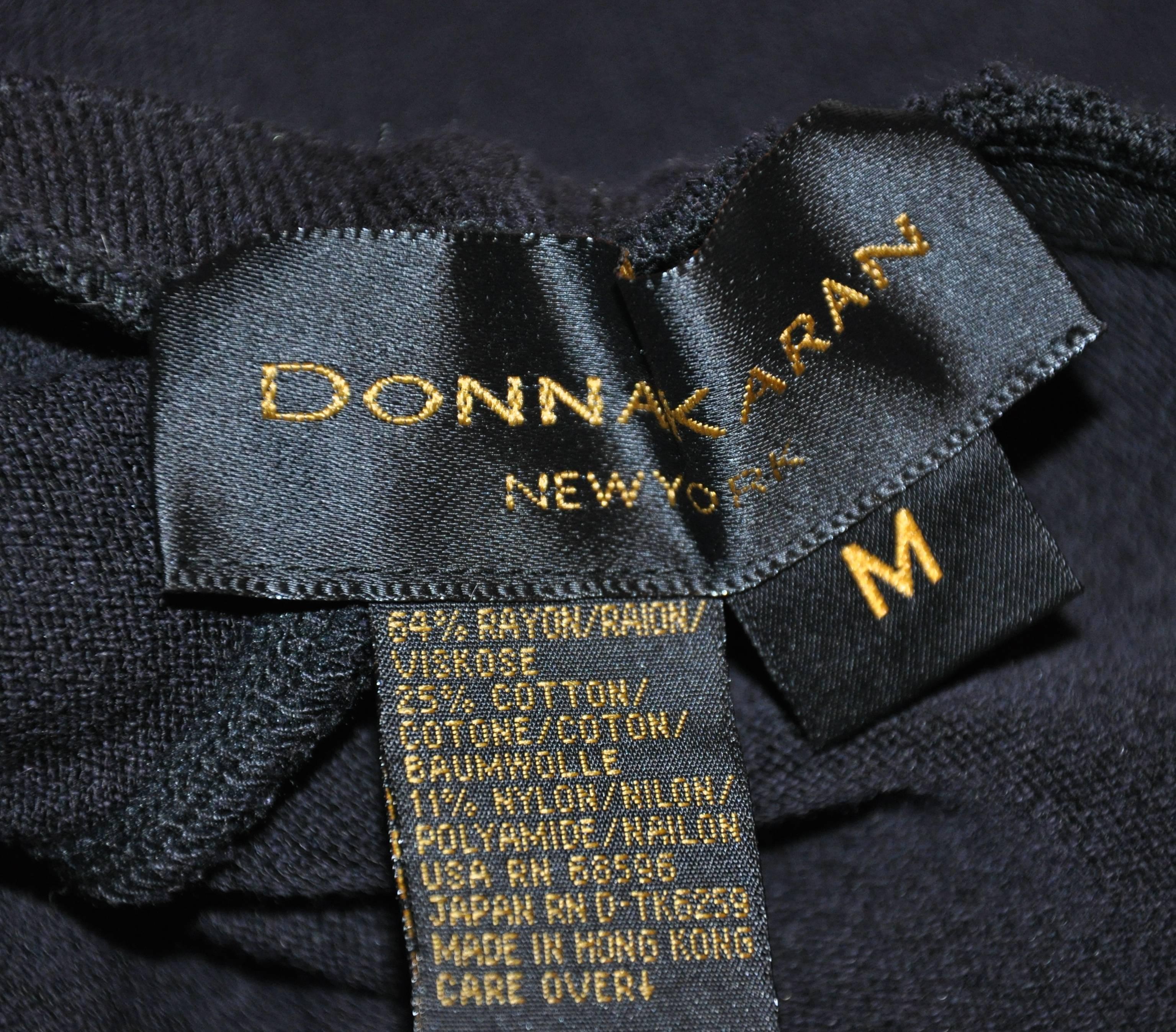      Donna Karan black tapered cuffs, slim fit elastic waist trousers measures 27