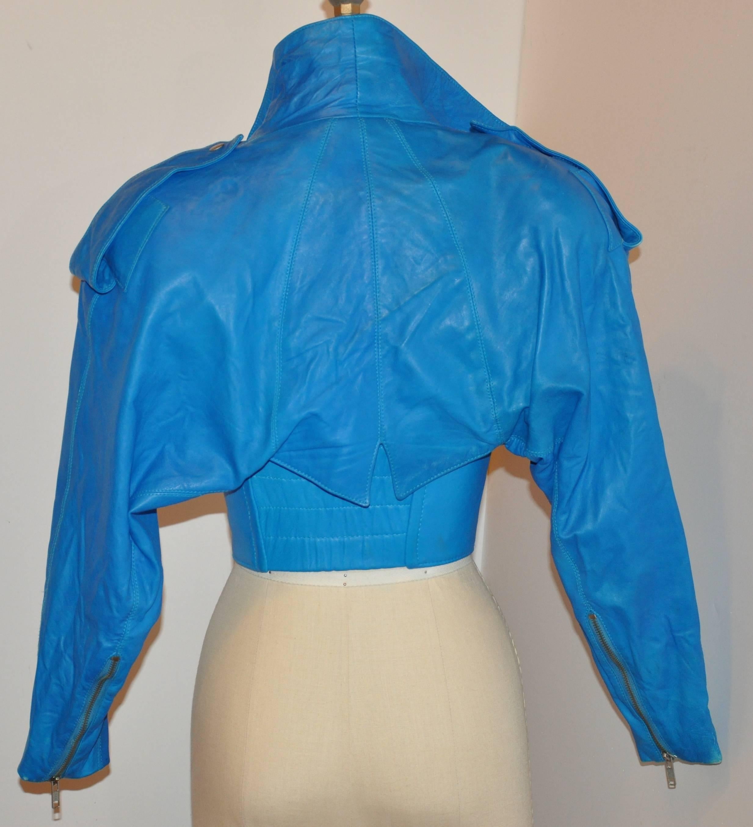           Michael Hoban for North Beach Leather wonderful 3-piece turquoise lambskin leather ensemble consists of a mini Motor-cycle style zipper jacket with two matching bustiers. The zipper jacket is size 3/4 with the hem circumference measuring