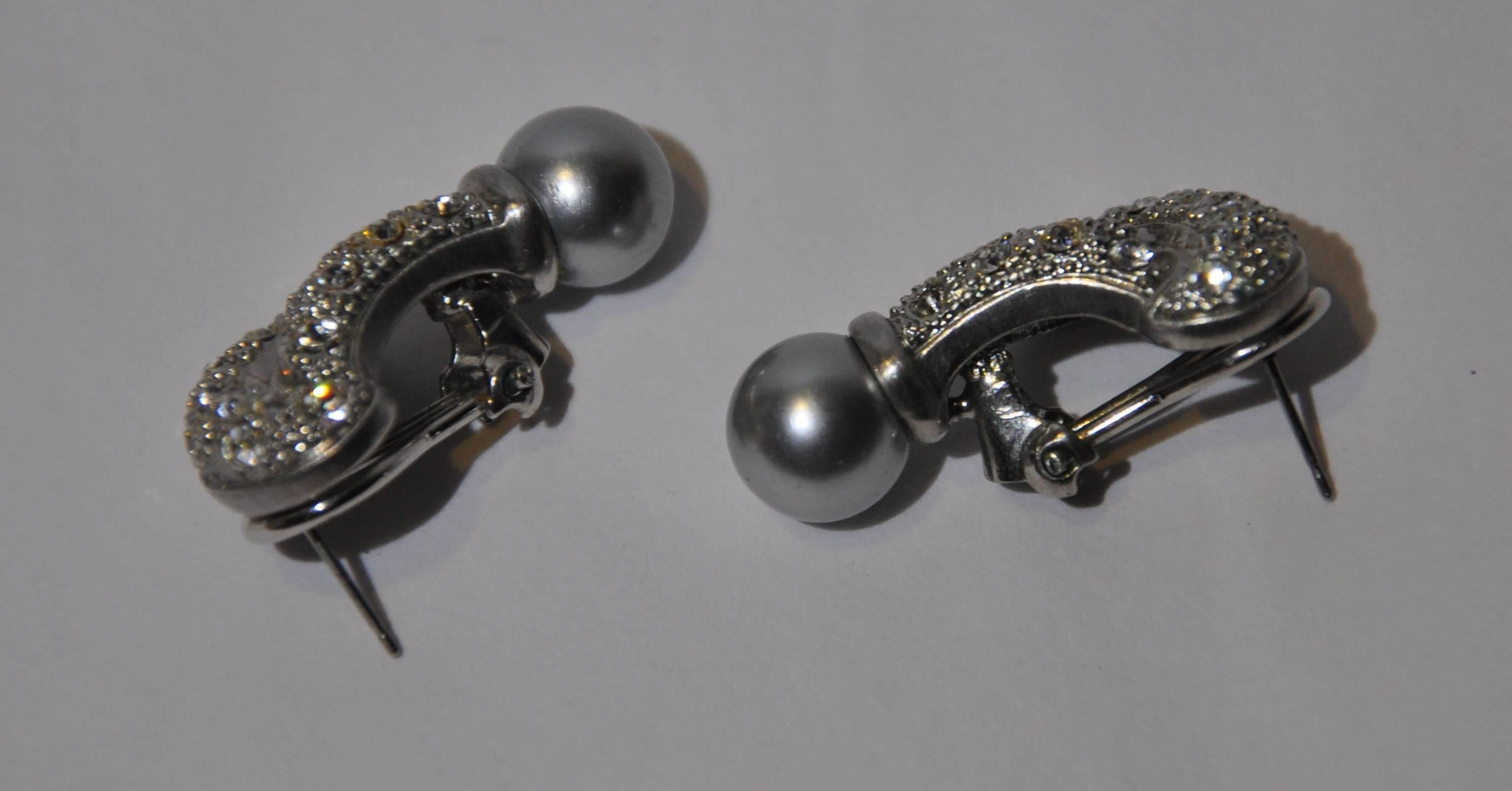          This wonderfully elegant silver hardware tone earrings is detailed with a single smoked pearl drop accented with beautifully cut rhinestones. There is one rhinestones missing on each earring, but, hardly noticeable.The length measures