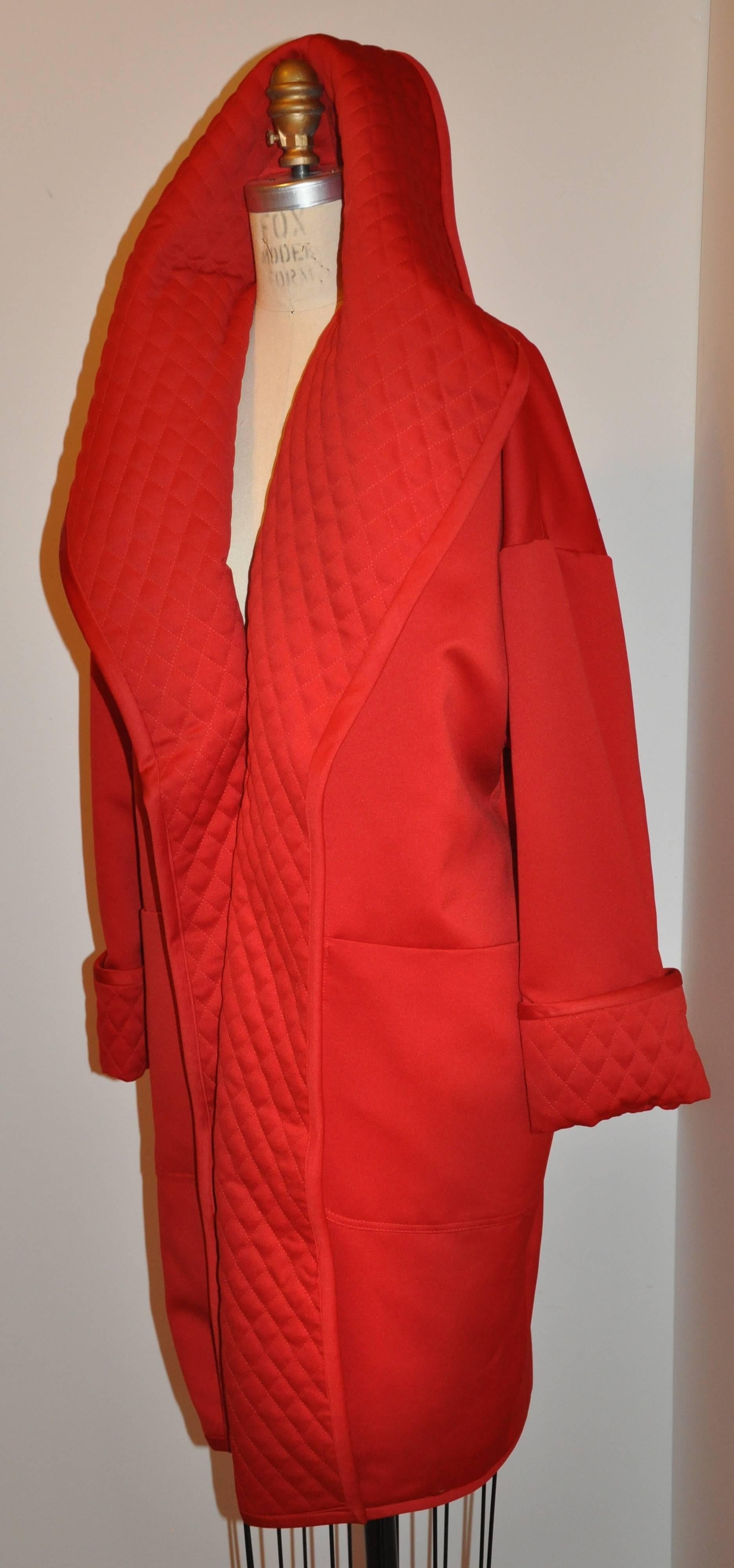           Victor Costa wicked bold engine-red silk evening overcoat is accented with an oversize shawl collar with quilted-like stitching. All edges are finished with same material piping accent. The front has two huge patch pockets detailing this
