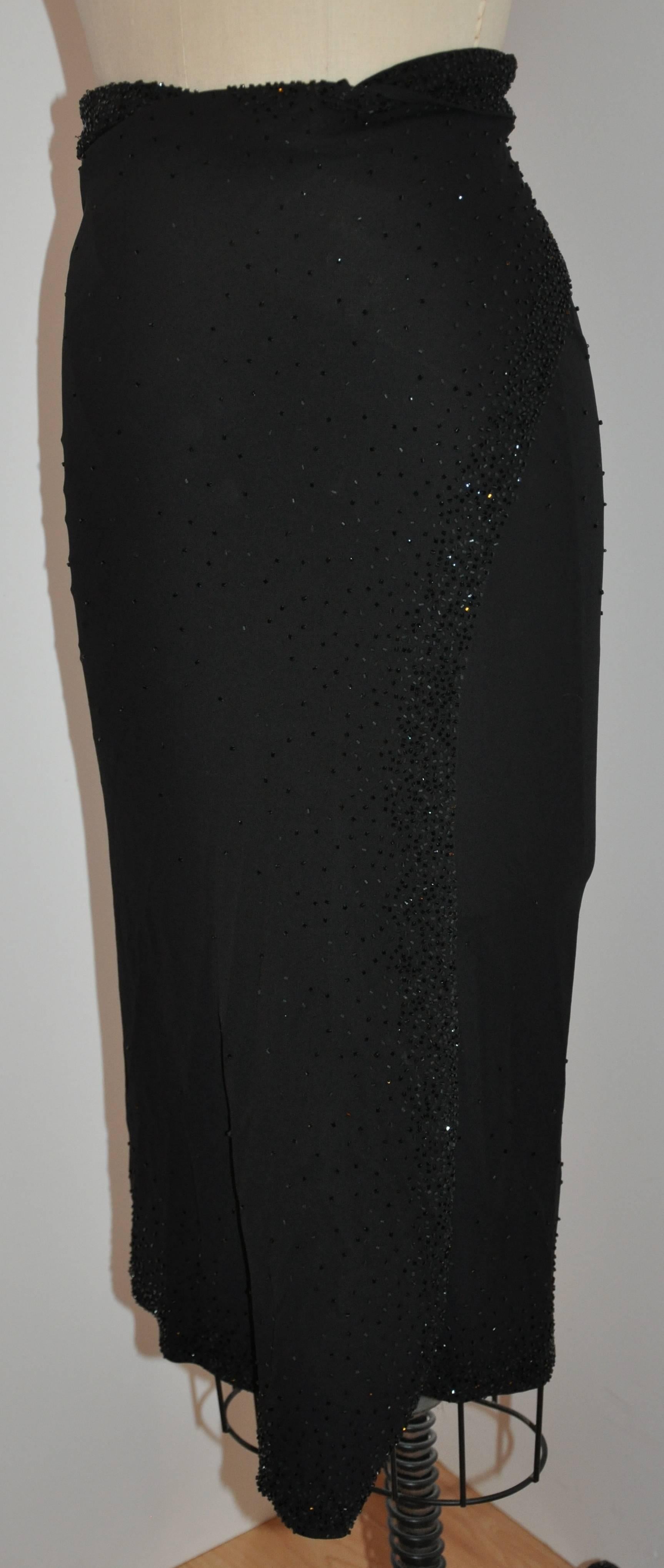           Donna Karan wonderfully elegant and timeless black silk jersey evening wrap skirt is delicately accented with micro seed bead embroidery scattered along the waist as well as along the edges in front. This evening skirt is simply elegant
