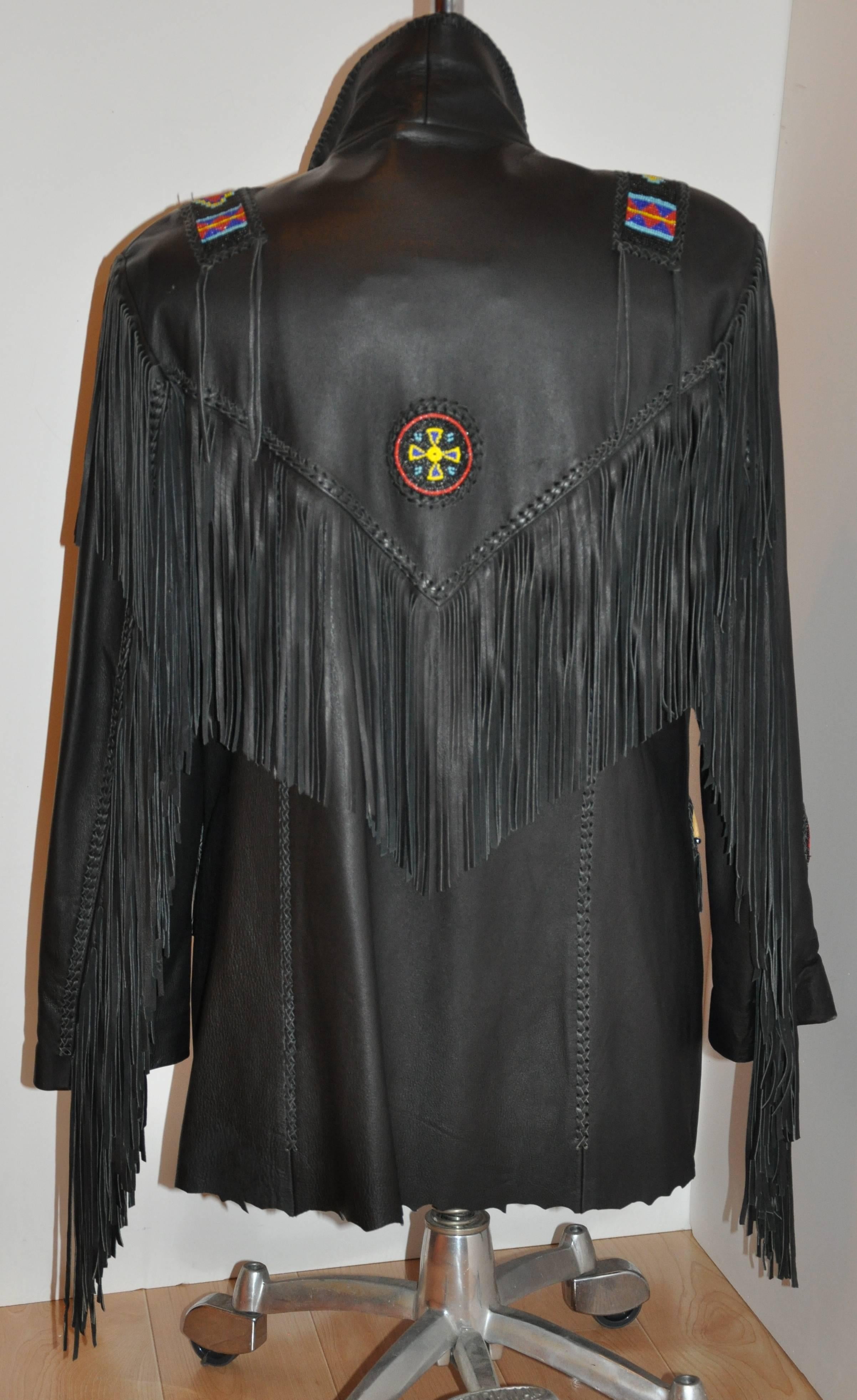         Michael Alle's wonderfully detailed hand-made men's western-style black butter-soft chamois lambskin fully-lined jacket has such detailing as detailed hand-done bead-work and hand-cut fringes. The front has two patch pockets with fringes