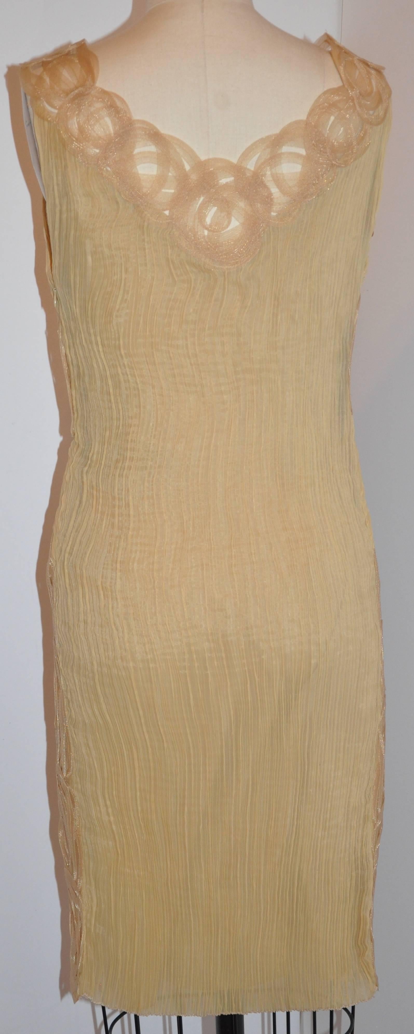         Alberta Ferretti wonderfully elegant cream & Tan "Ribbon" sleeveless cocktail dress is fully lined with silk. There is an invisible side zipper which measures 11". The front center length measures 32", back center is