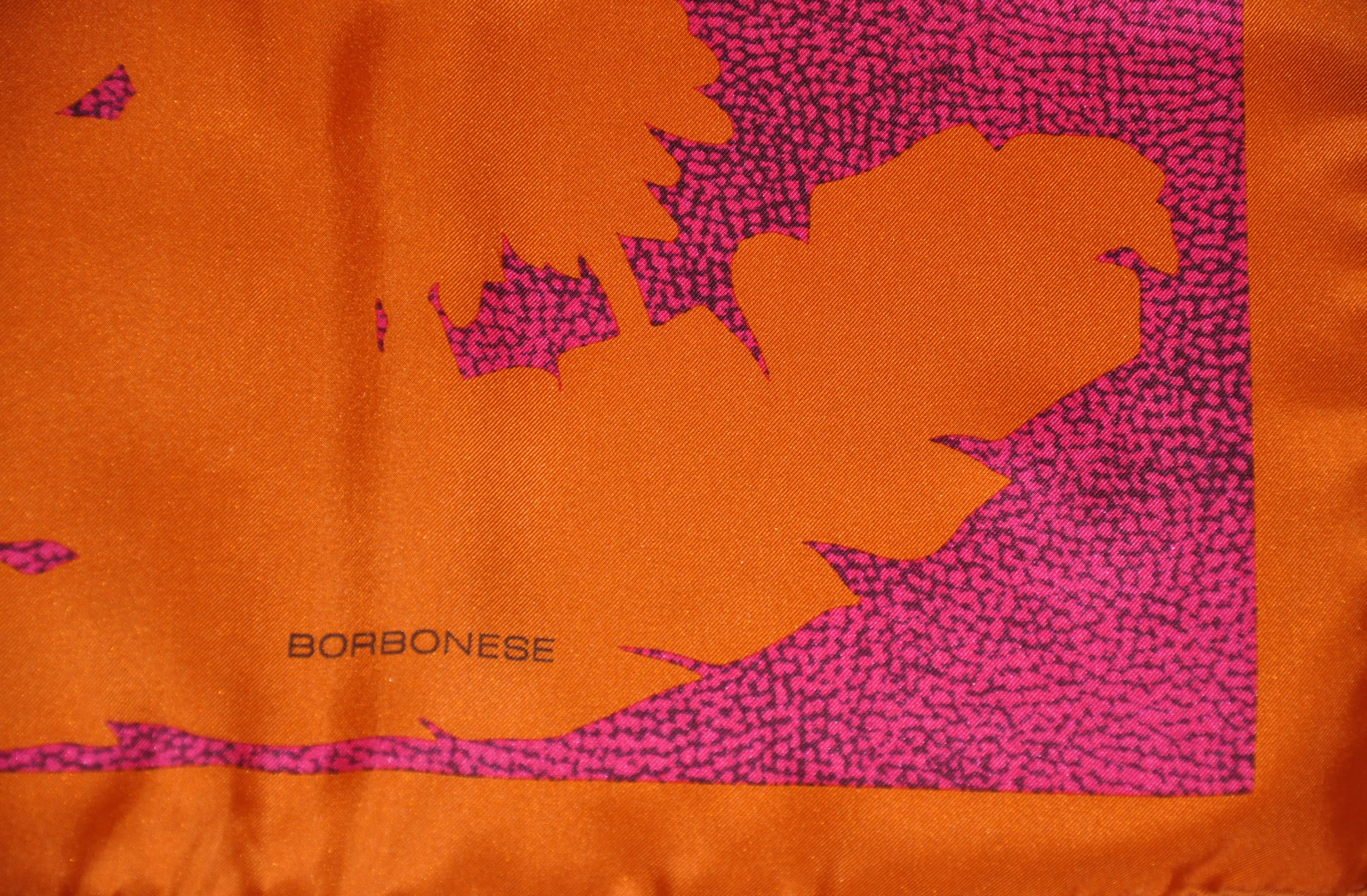         Borbonese wonderful floral print silk scarf in bold fuchsia & tangerine makes for a classic and elegant scarf. The scarf is finished with hand-rolled edges still with original tags attached. Made in Italy, measuring 34