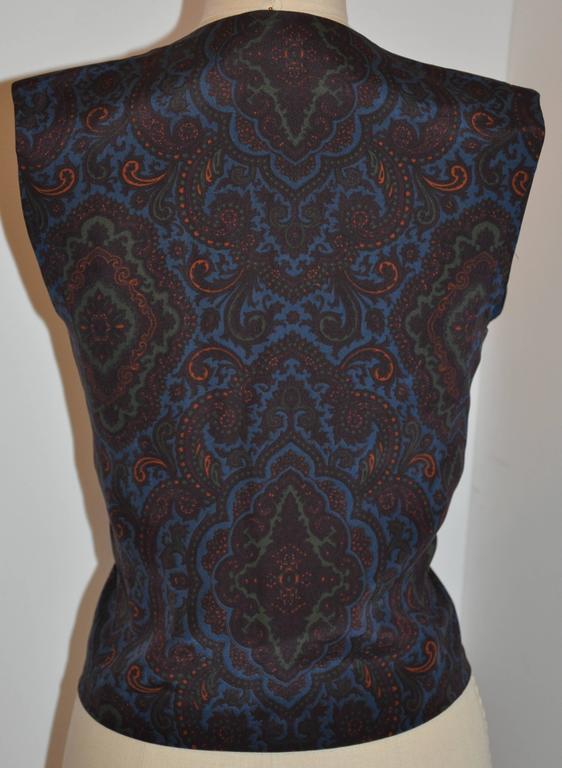       Donald Brooks multi-color multi-palsey print silk vest if fully lined with silk. The front ball buttons are silk-covered as well as the eyelets. The total length measures 20