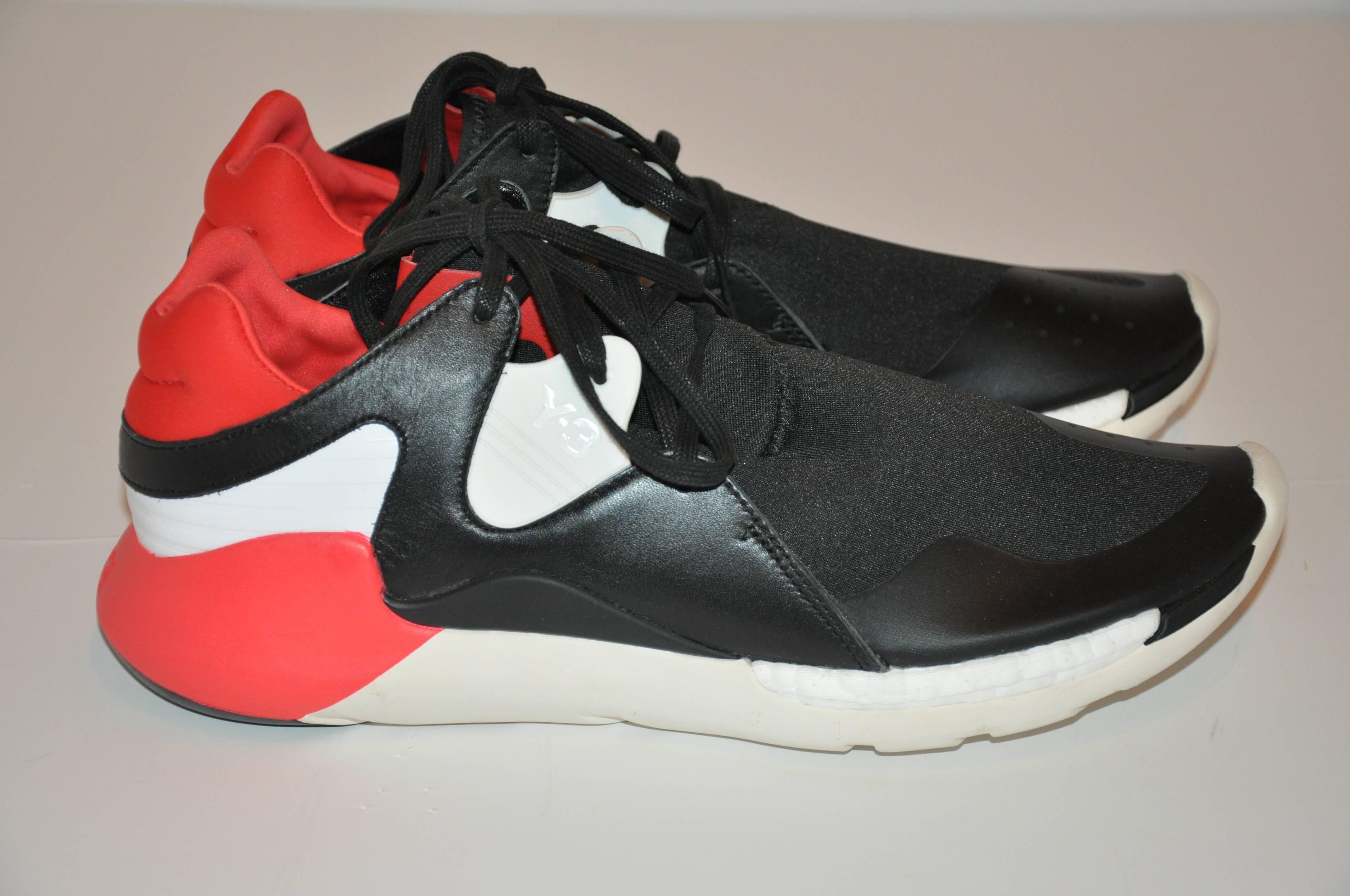         Yohji Yamamoto men's multi-colors of black, white and accented with bold neon red with lace-up rubber sneakers measures 12 1/2