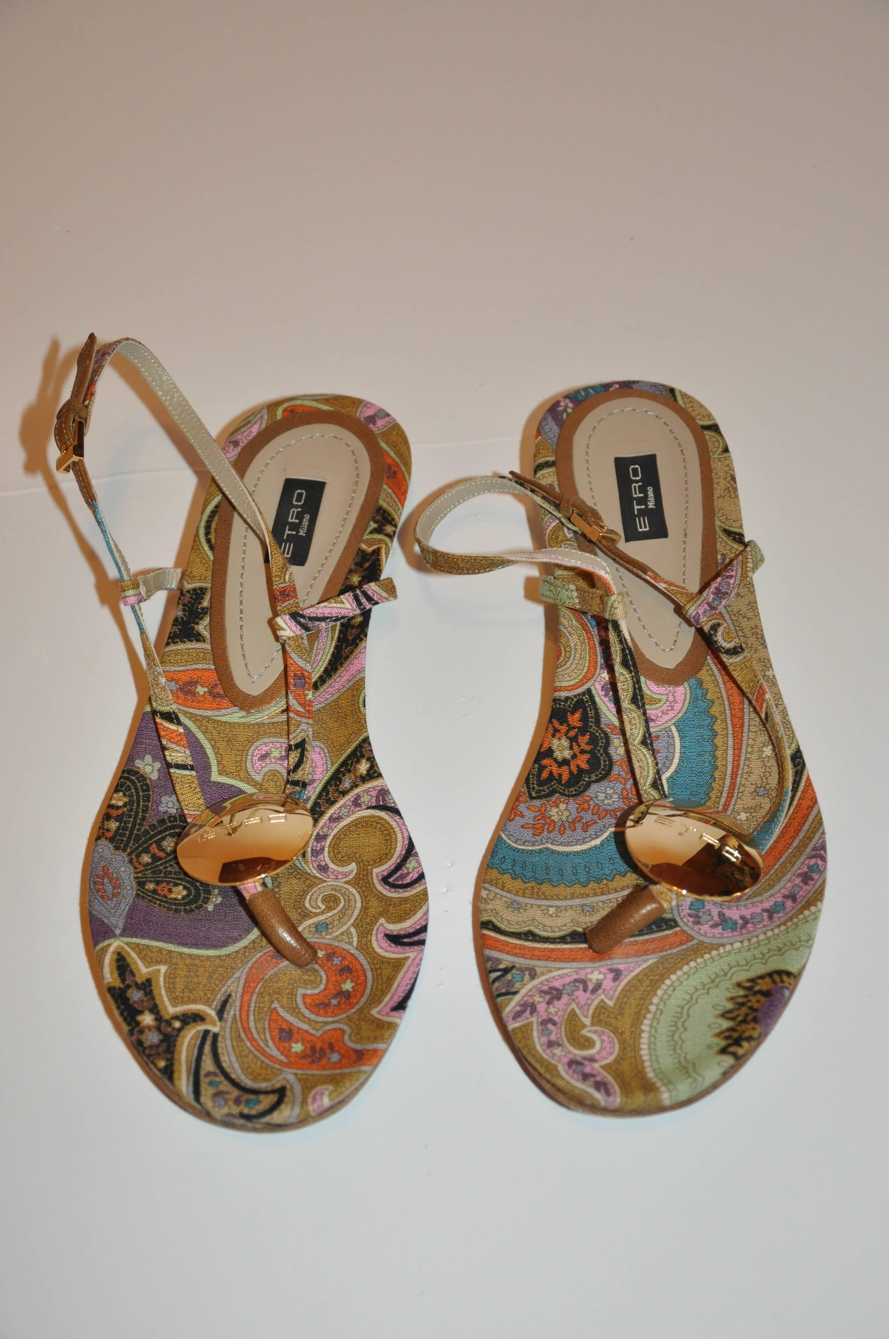         ETRO's wonderful multi-color silk-linen palsey-print low-heel sandal is accented with a gold-tone emblem in front as well as the adjustable straps. The total length of this lady's sandal measures 11