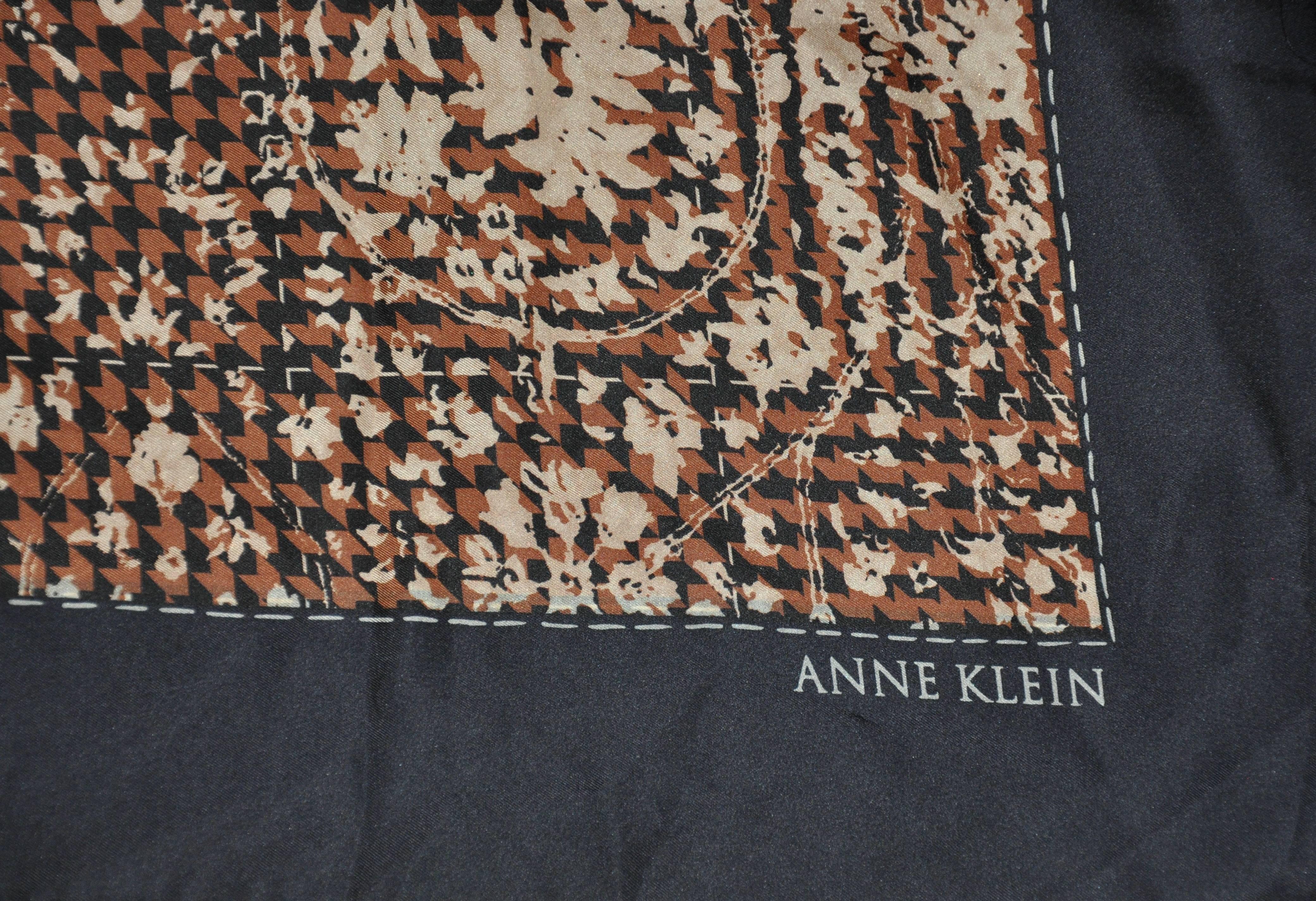      Anne Klein multi floral scarf is accented with black borders and finished with hand-rolled edges. This wonderful scarf measures 34