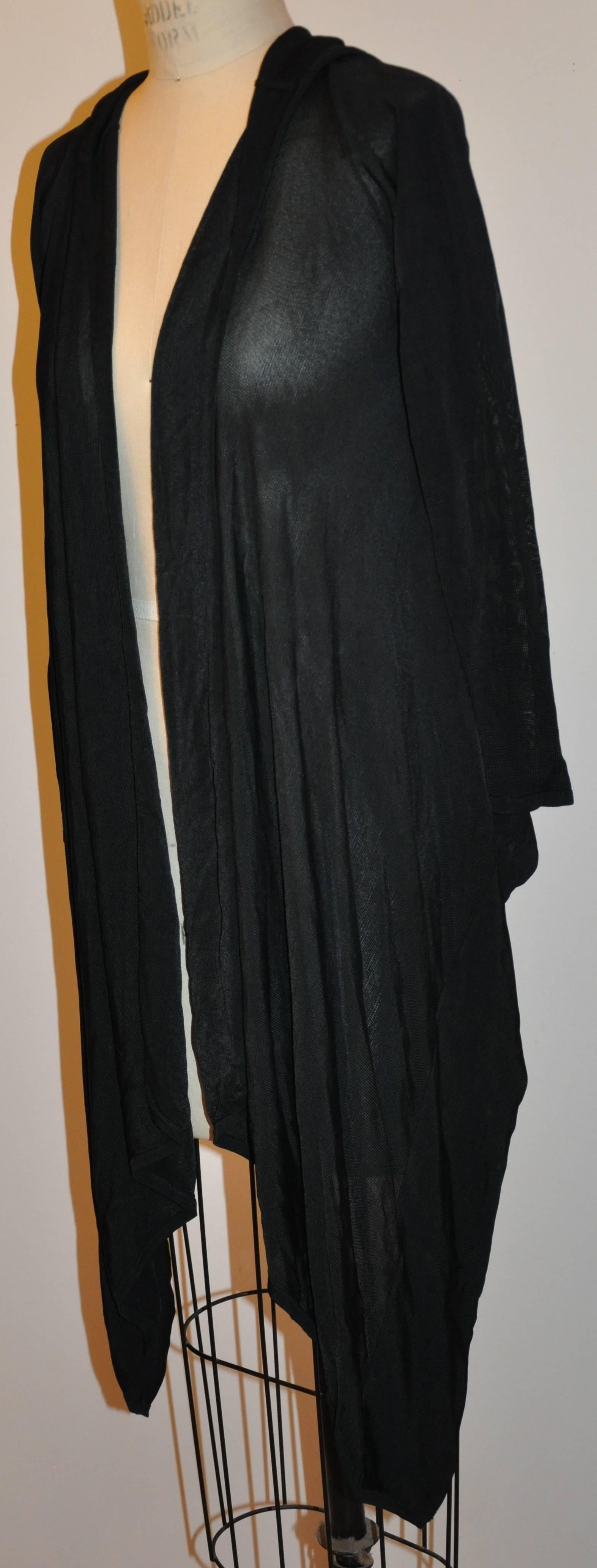        Herve Leger black asymmetric cut black jersey open cardigan draped wonderfully over the bodice when wearing. The length in back measures 22