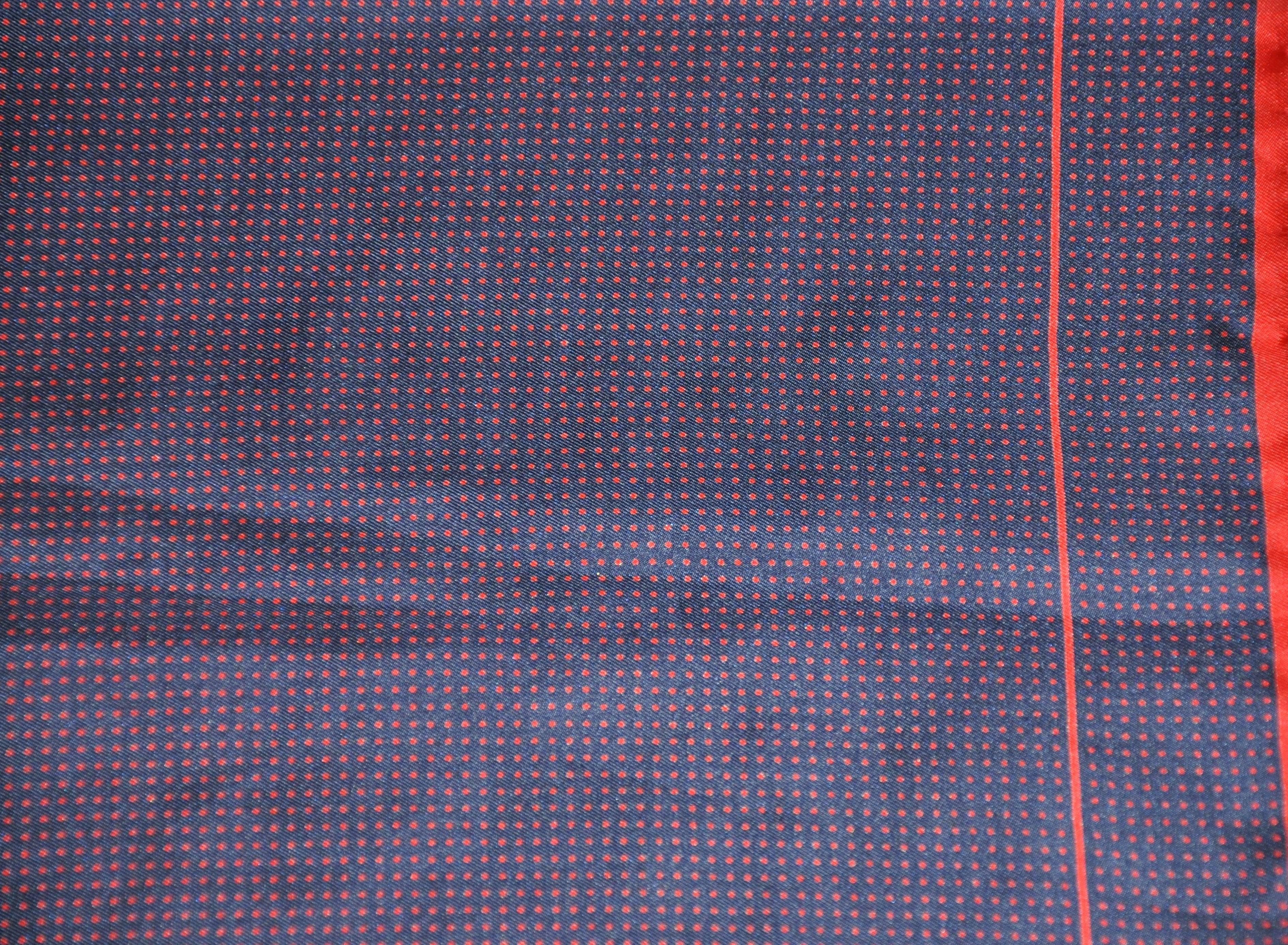        Pierre Cardin navy polka dot silk handkerchief is accented with hand-rolled red edges. This handkerchief measures 18