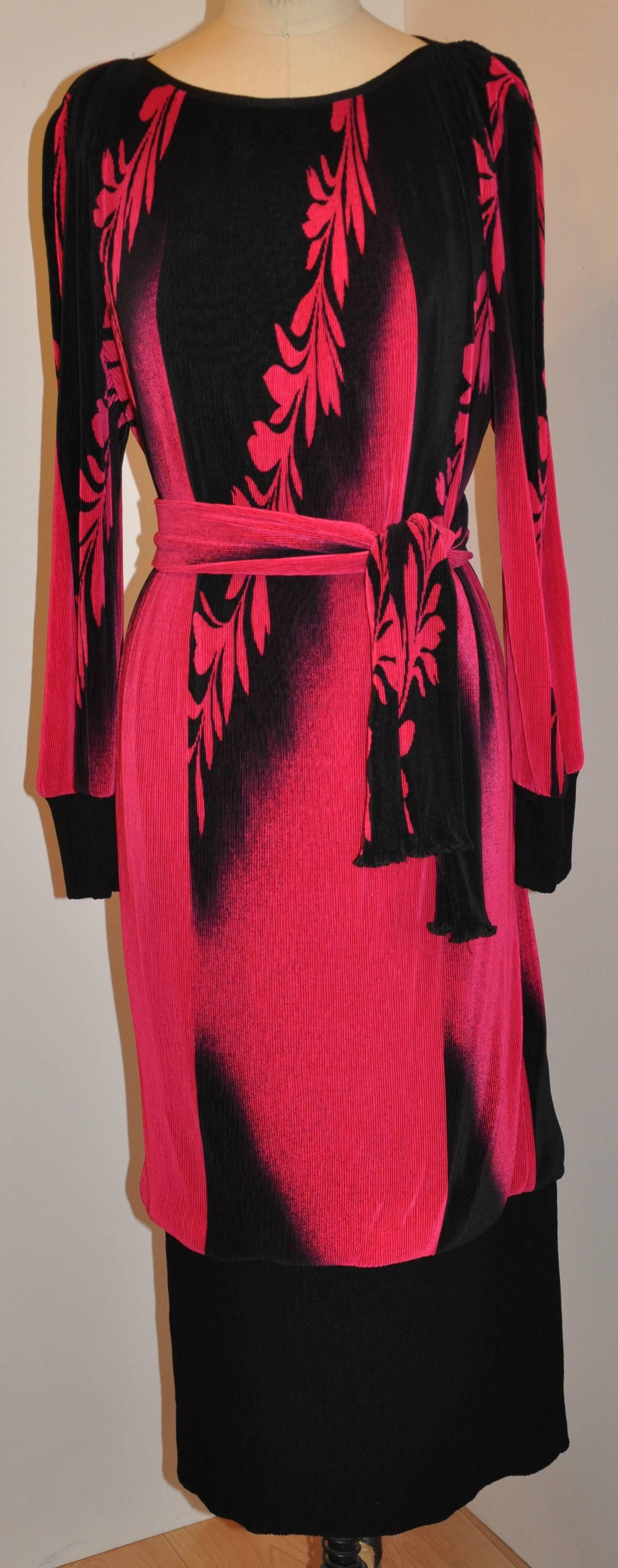        Virginie (Paris) wonderful elegant boatneck accordian dress is fully lined. This lovely dress has an optional self-tie belt in which one can use as a tie-belt, or, as a scarf if desired. A wonderful combination of fuchsia and black, this