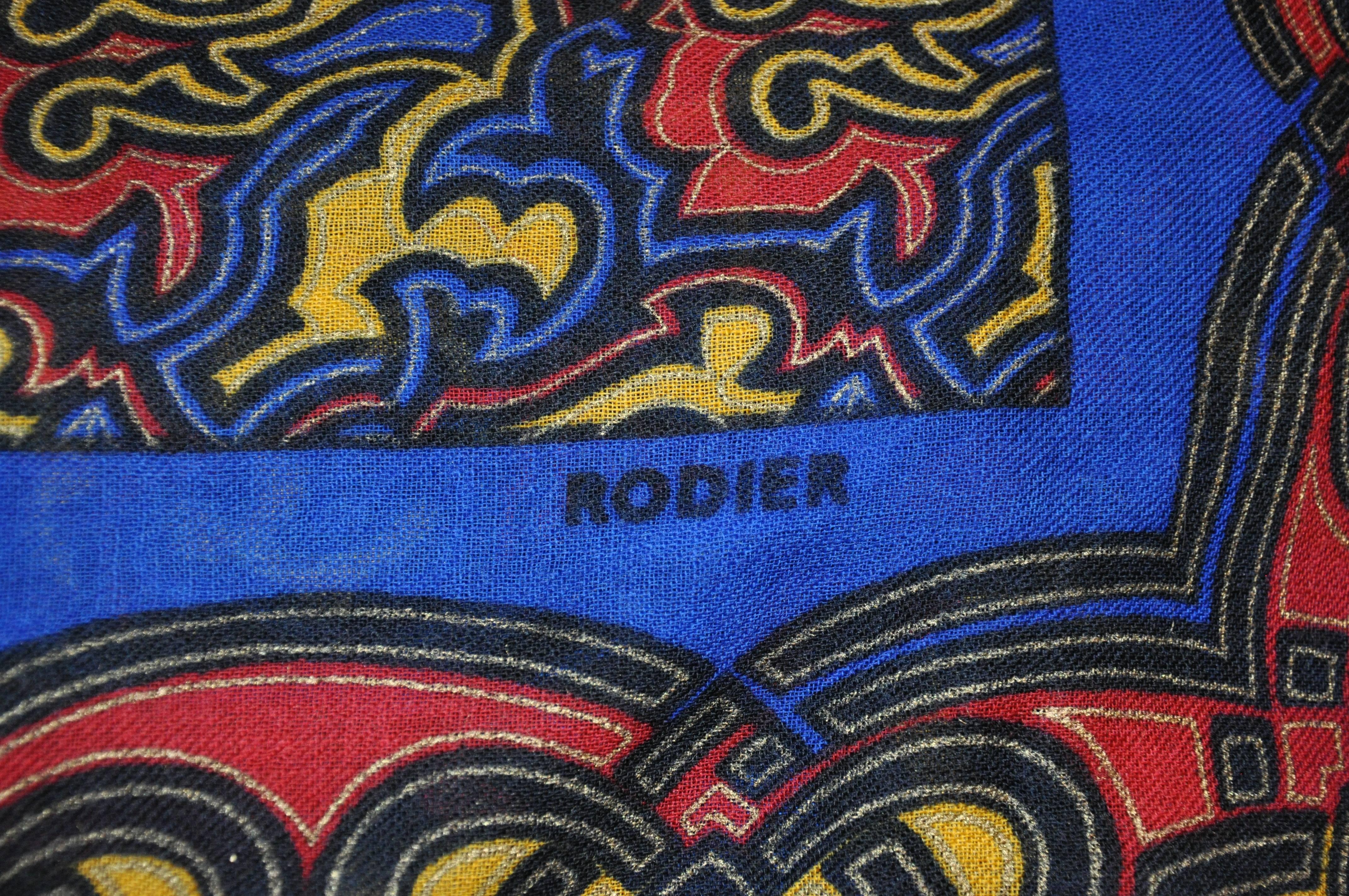         Rodier's wonderfully richly detailed huge bold abstract wool challis shawl is accented with fringed edges as well as their signature name logo. This wonderfully huge shawl which measures 53