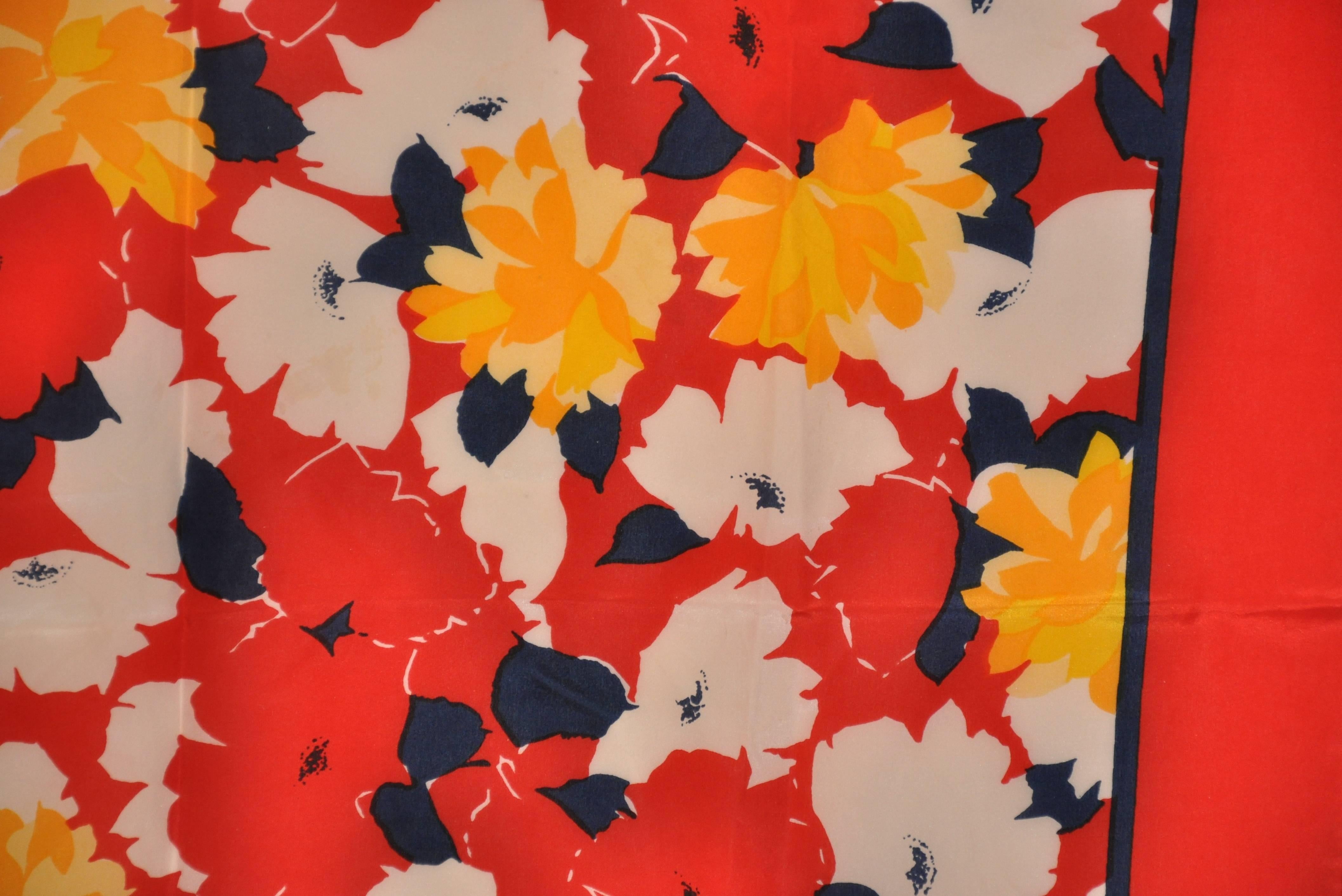      This wonderful bold multi floral silk scarf has red borders and finished with hand-rolled edges. This silk scarf measures 28
