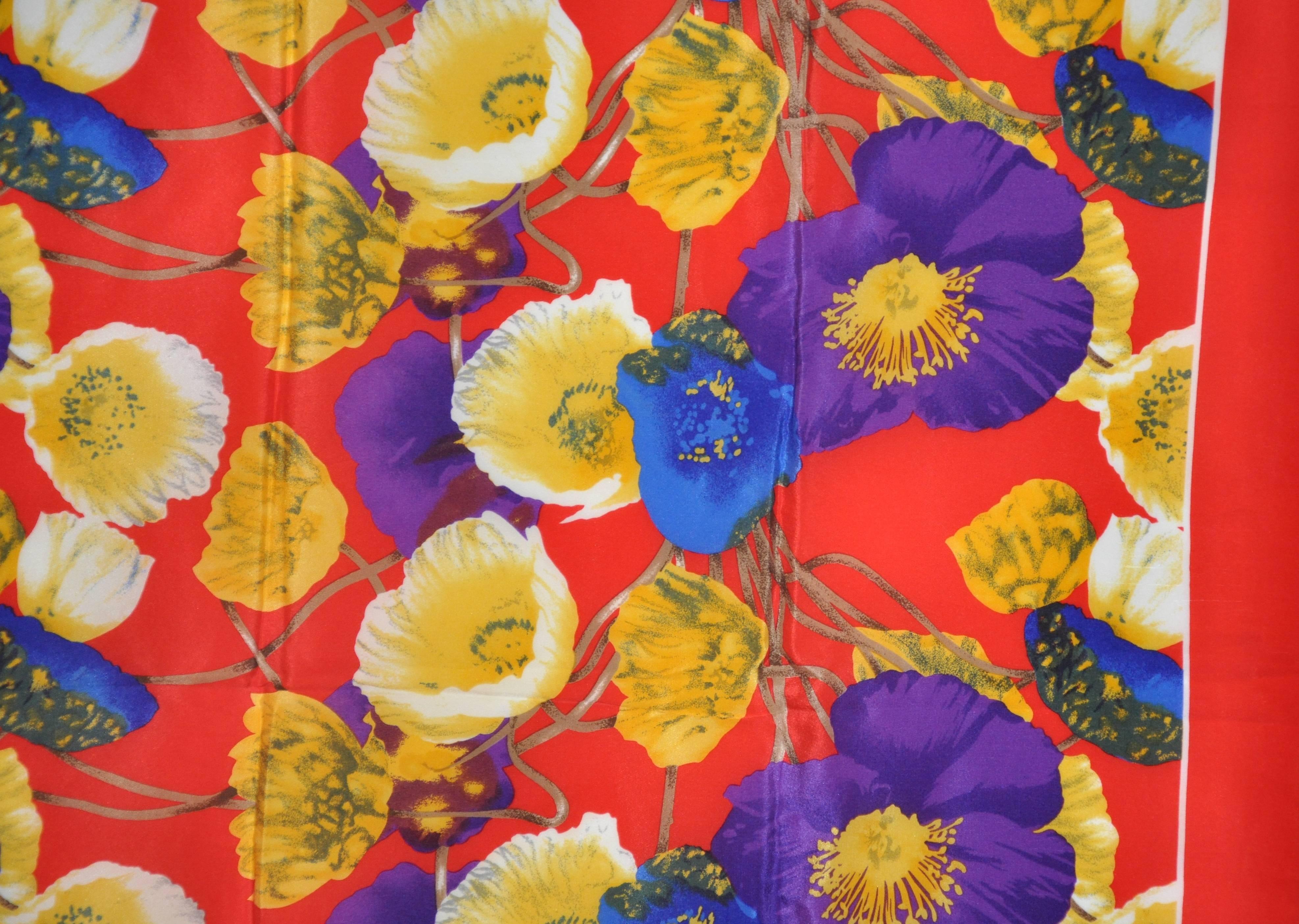      Linda Allard for Ellen Tract Bold multi-color multi-floral silk scarf is finished with hand-rolled edges and measures 34
