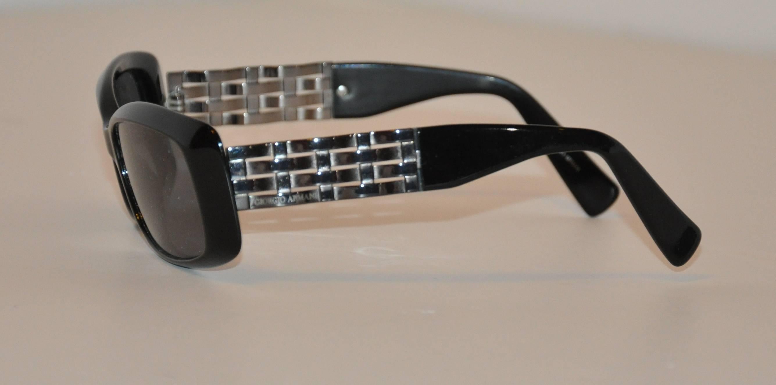        Georgio Armani thick black lucite sunglasses are accented with detailed 
