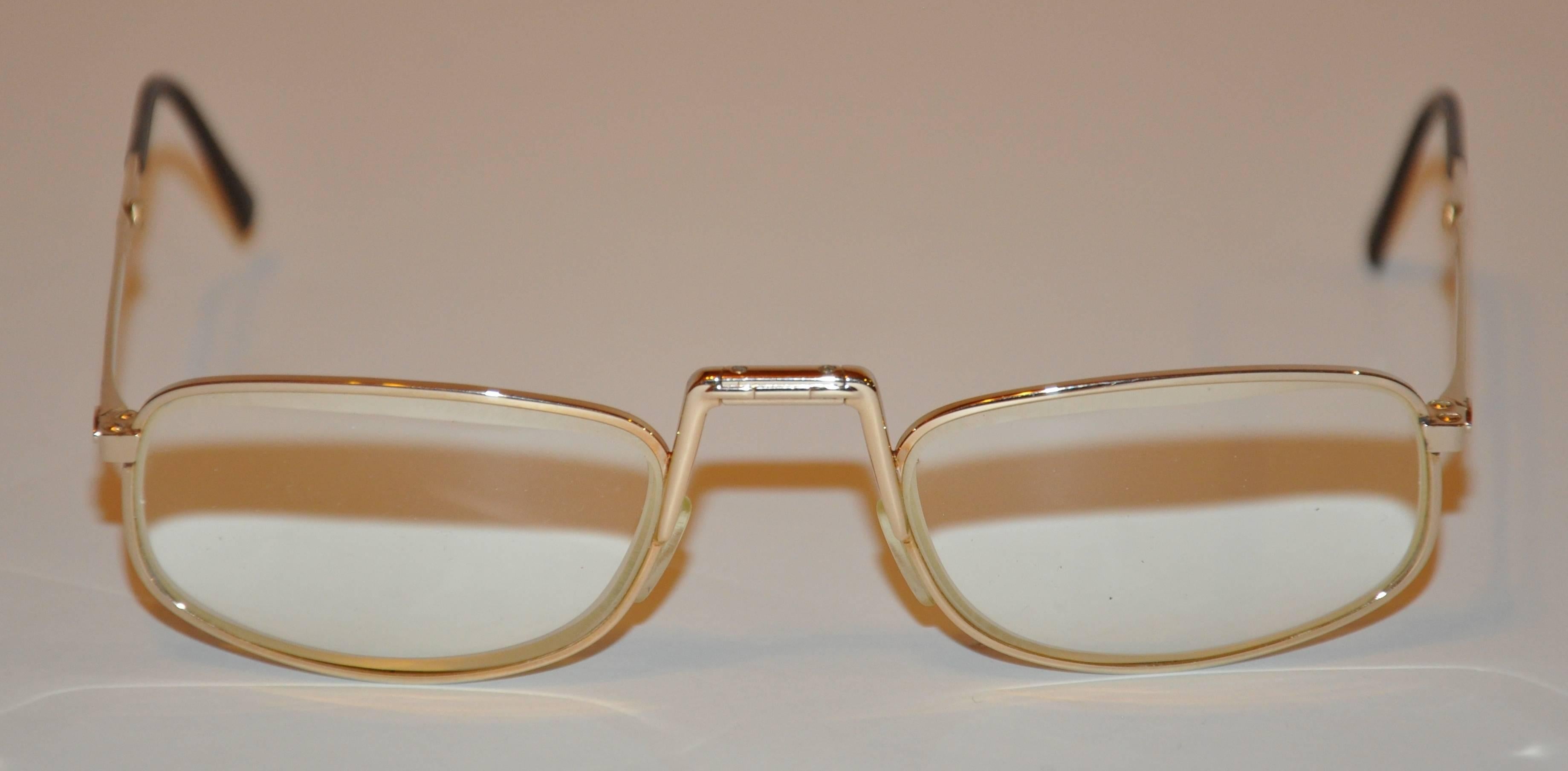        Christian Dior timeless foldable gold hardware frame eyeglasses folds into 2 1/2" x 1 1/2" x 1". When opened to full size, the width measures 5 1/8" across the front, height is 1 1/4", arms are 5 1/4" in length,