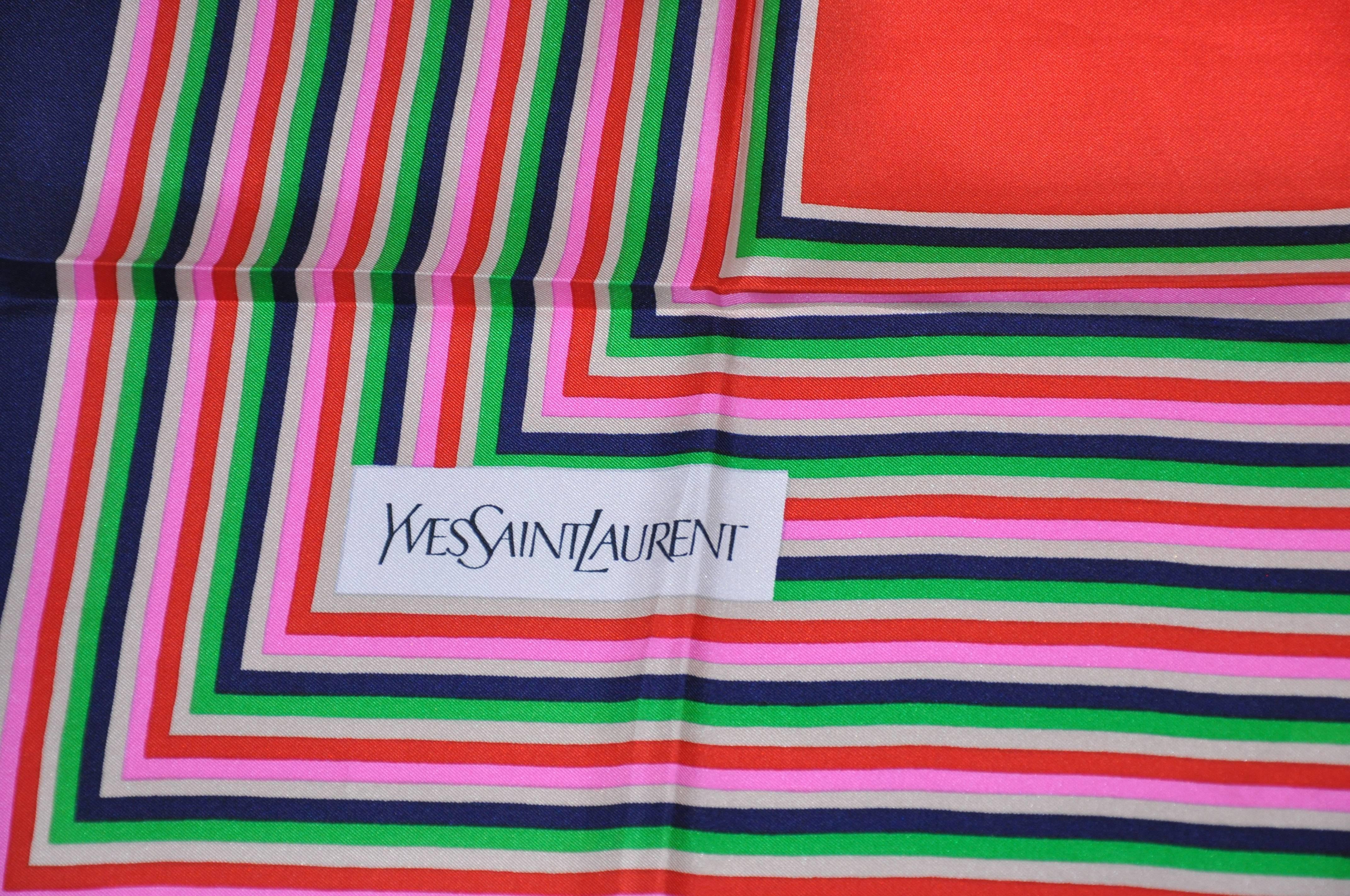        Yves Saint Laurent wonderful multi-colors of red, pink, navy, beige and green stripe silk jacquard scarf is finished with hand-rolled edges and measures 33