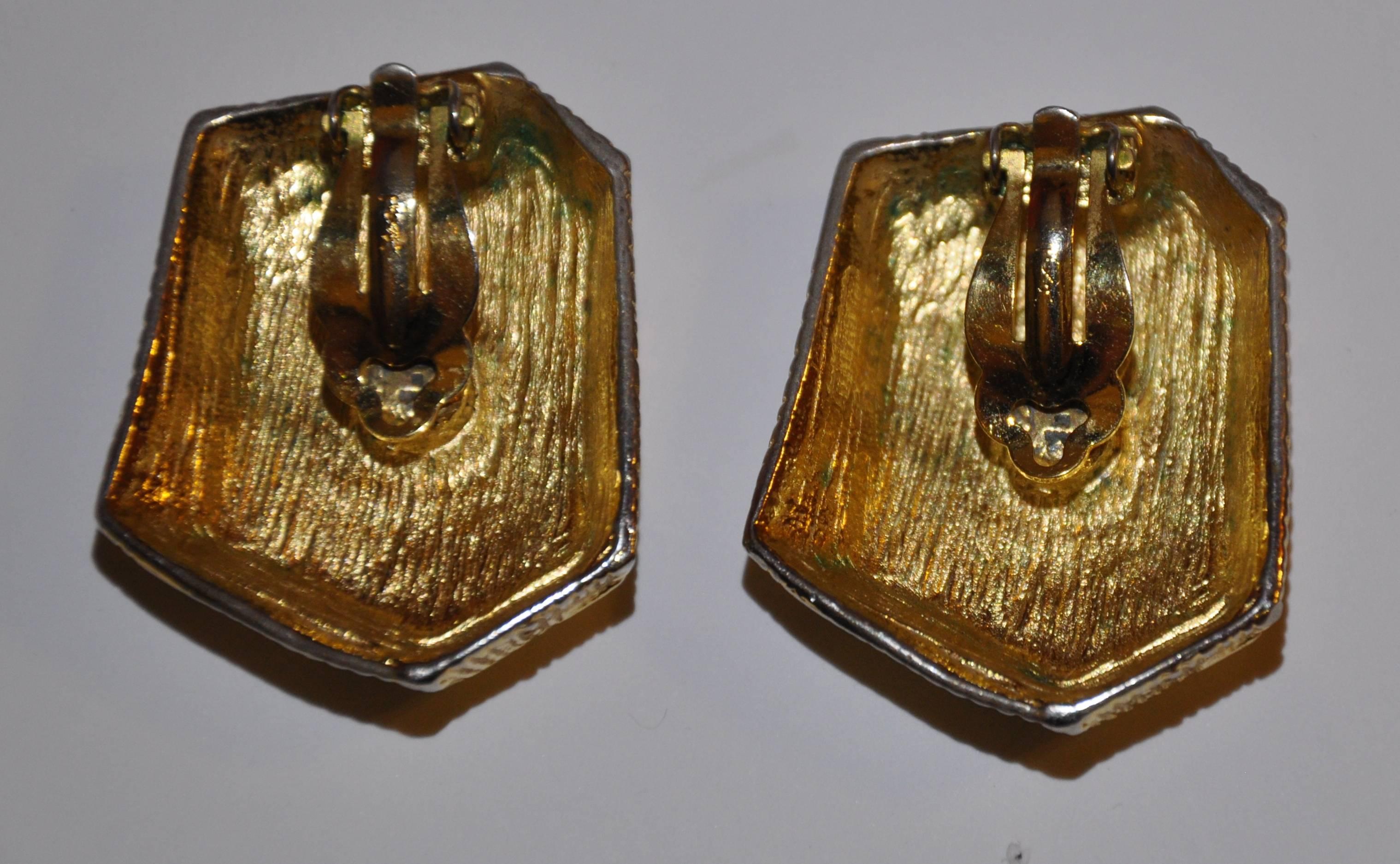       Yves Saint Laurent large Abstract shape clip on earrings measures 1 5/8" in height, 1 1/8" in width and 3/8" in depth, The signature YSL is engraved on the back, made in France.