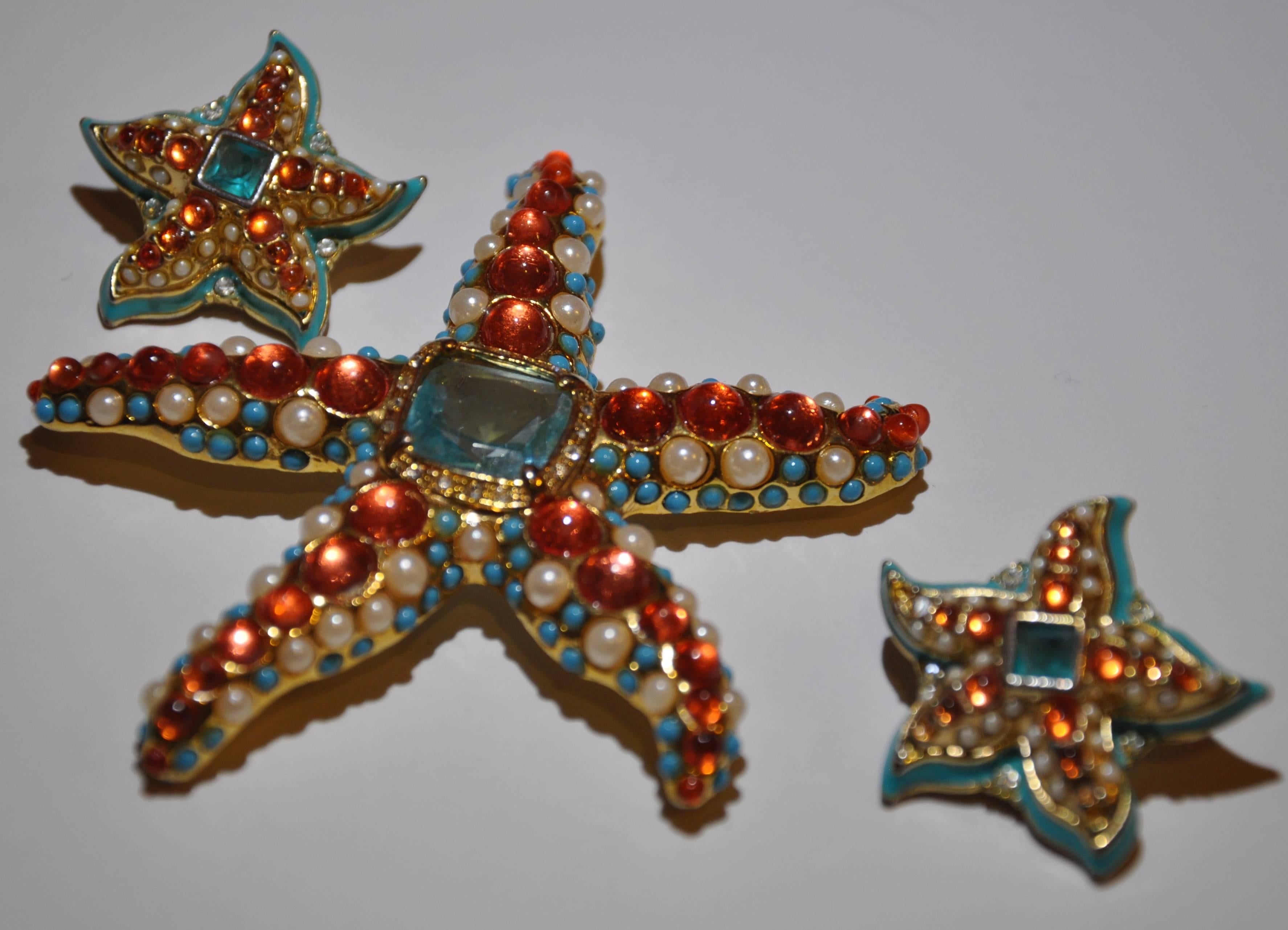        Kenneth Jay Lane's wonderfully whimsical "Starfish" set includes a large multi-color brooch as well as a set of matching earrings. One earring has three micro stones missing but hardly noticeable. The Large brooch measures 3