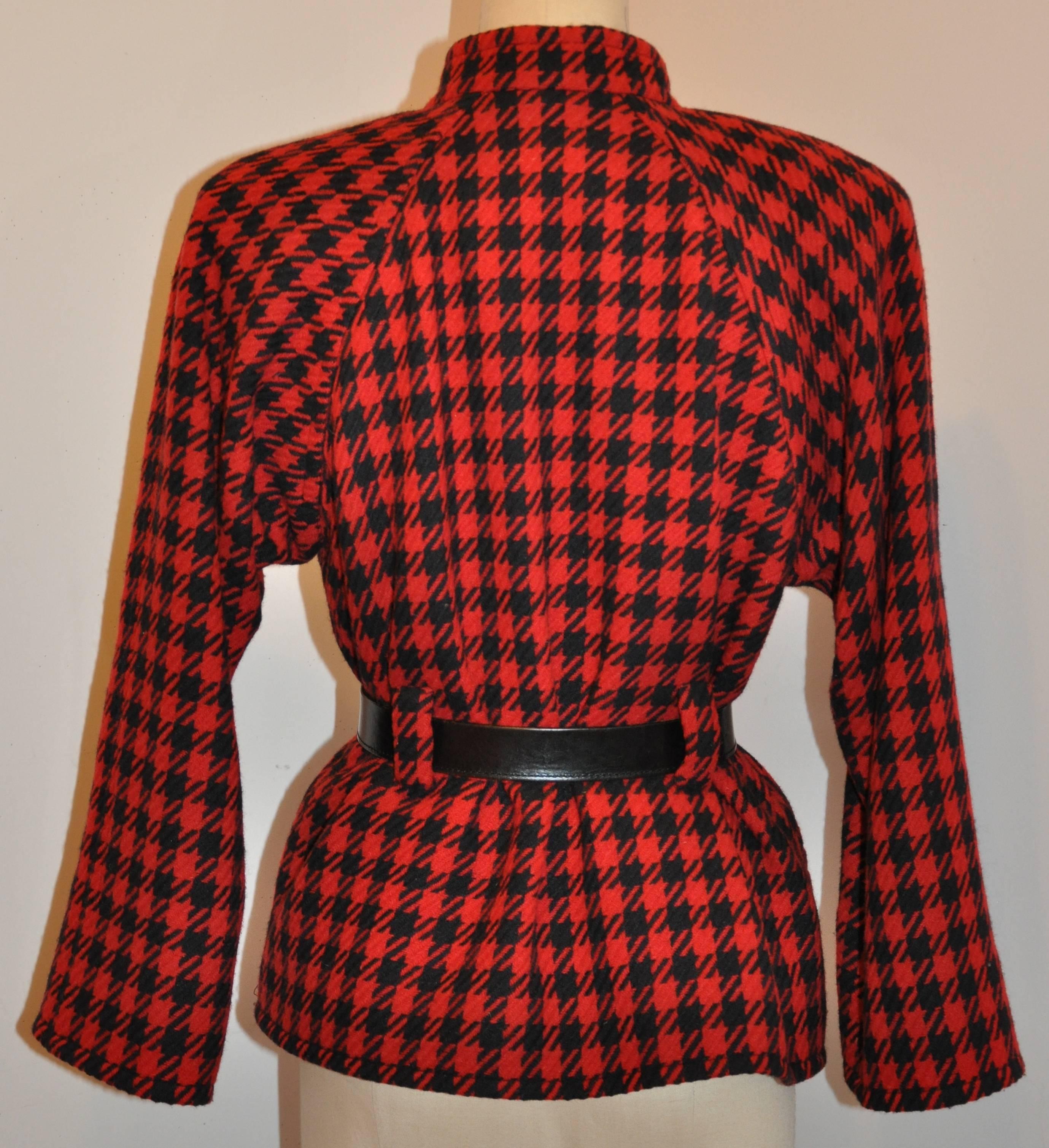        Yves Saint Laurent wonderfully tailored black & red jacket gives the option of wearing with or without a belt. (Belt shown in photo is not included).  Fully lined with black silk, this five-button front jacket measures 18
