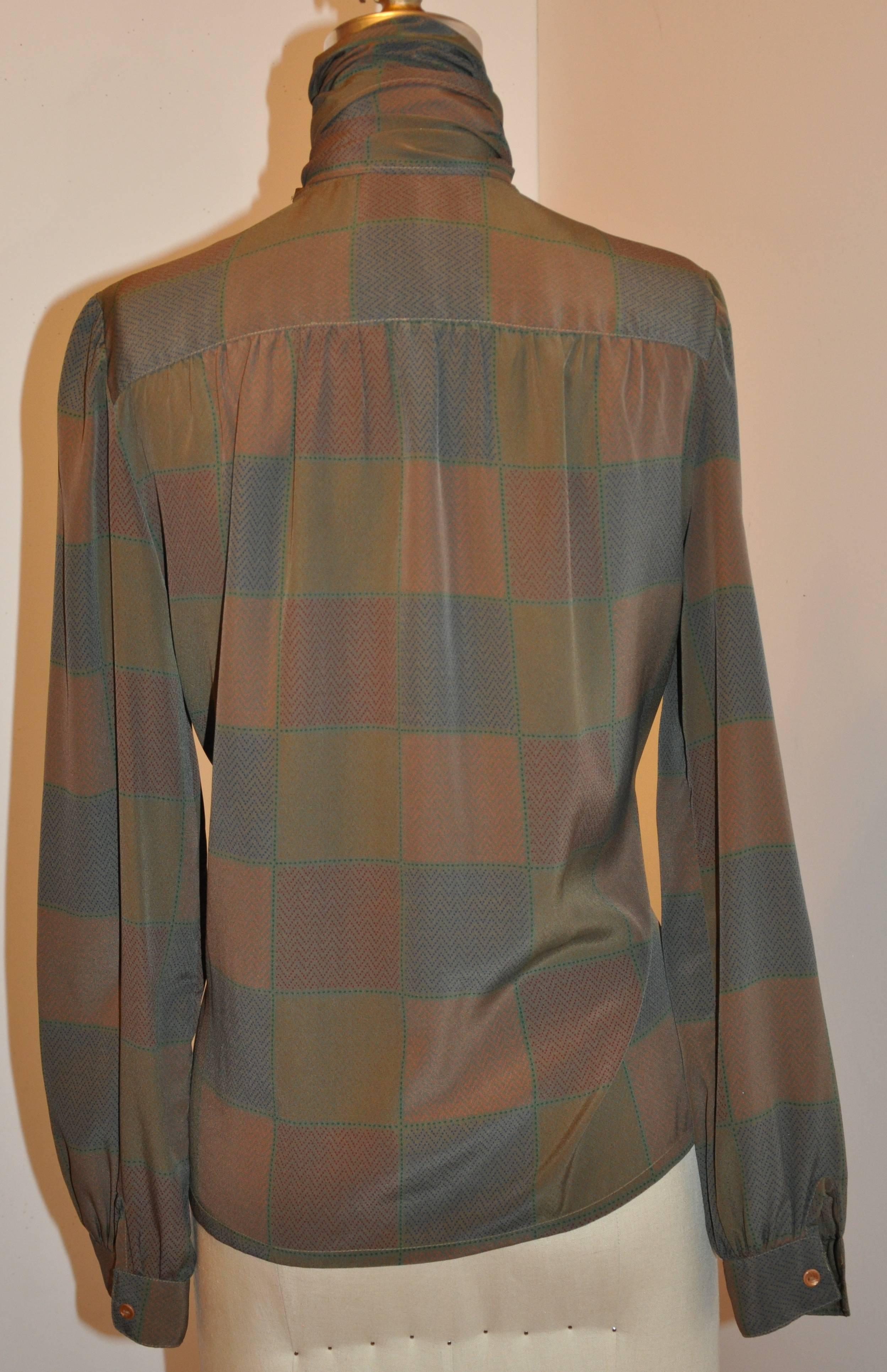         This wonderful elegant silk button blouse with multi-color 