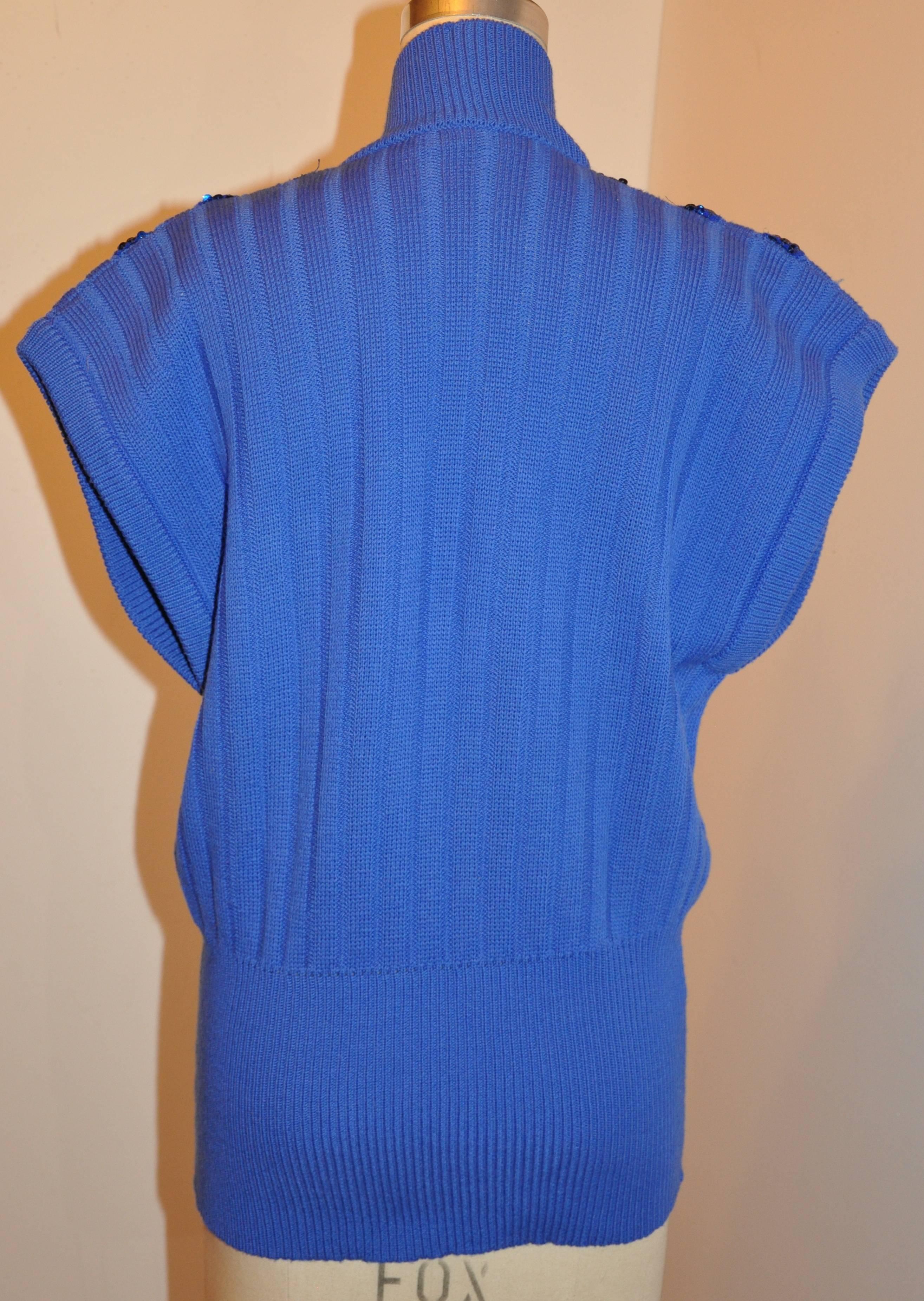        Escada by Margaretha Ley wonderful majestic blue ribbed wool pullover top is accented with dark navy sequins. The shoulder measures 23