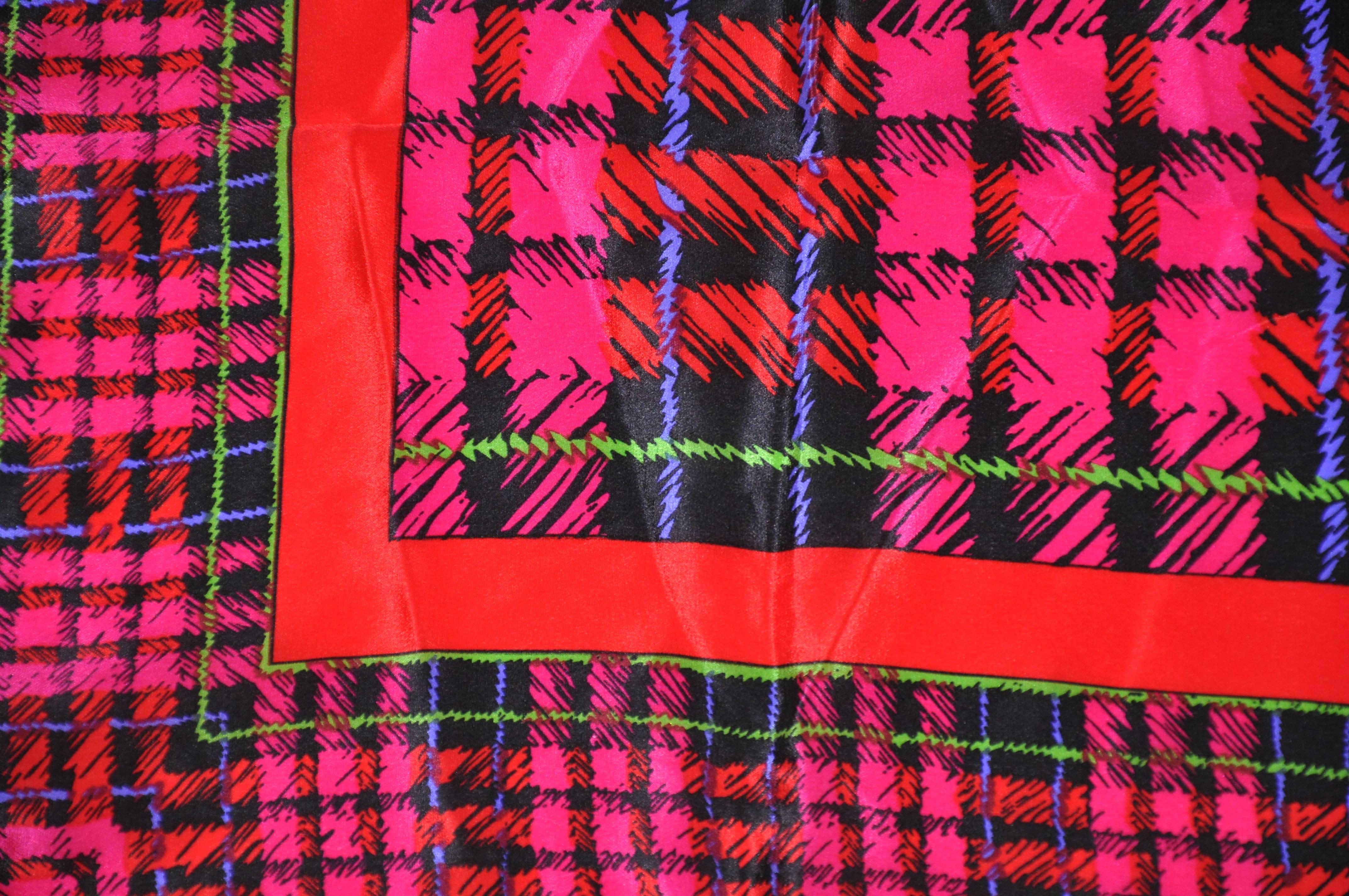   Vivid fuchsia with green & plum accent plaid silk scarf measures 31" x 31" and finished with rolled edges. Made in Italy.