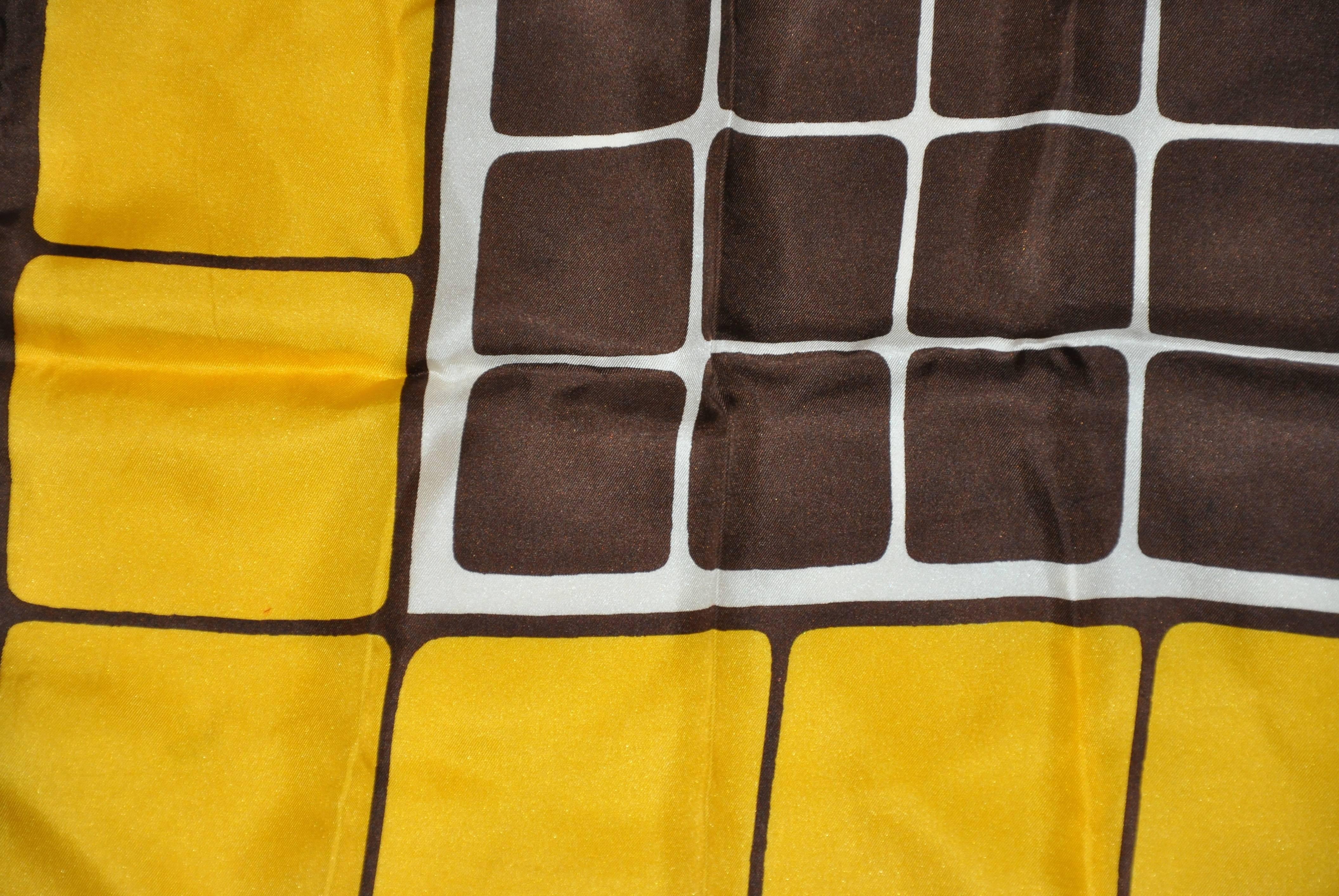 Symphony "yellow & brown color-block" silk scarf measures 26" x 26" and finished with hand-rolled edges. Made in Italy.