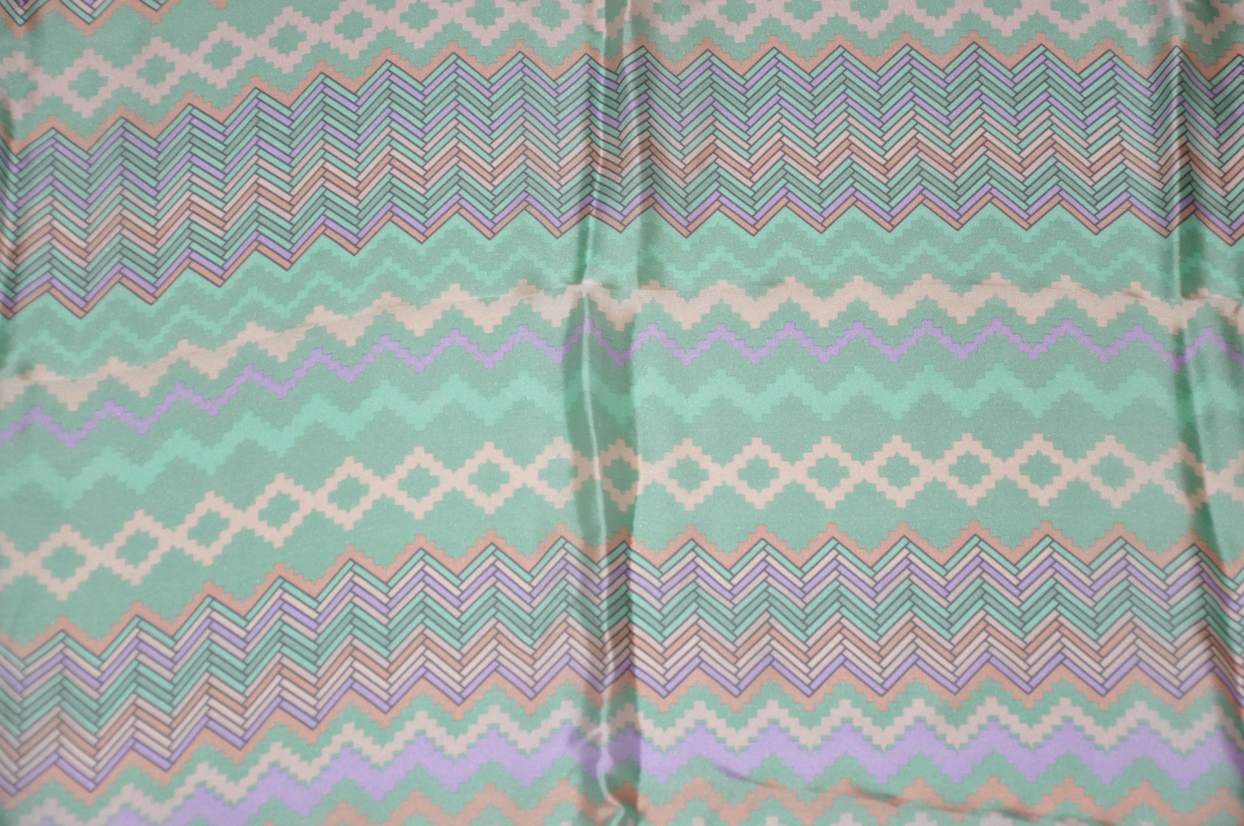        Missoni powder green border with multi-color zig-zag center silk scarf is finished with hand-rolled edges and measures 34" x 34". Made in Italy.