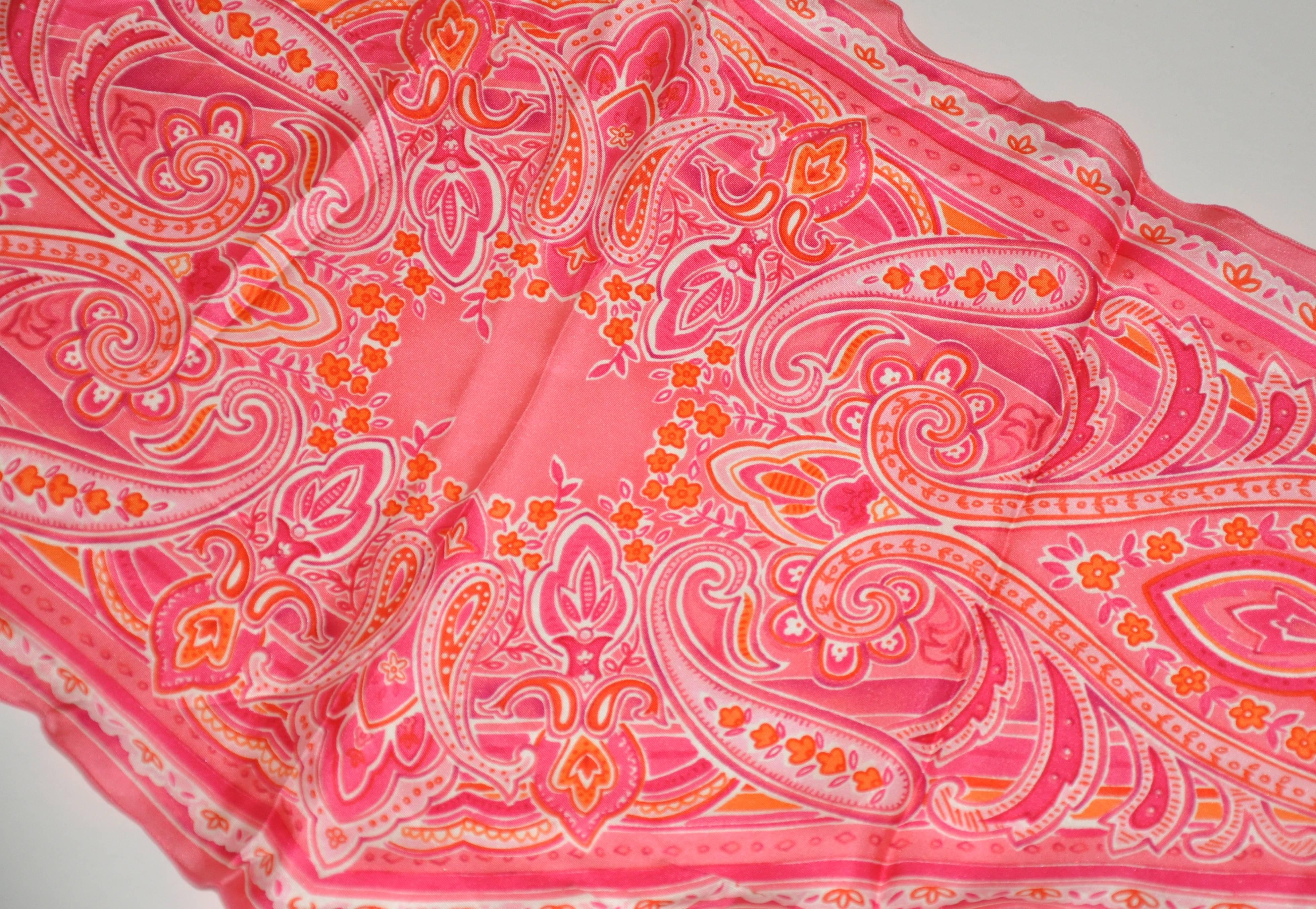 This wonderfully vivid combination of fuchsia & tangerine oblong silk scarf measures 14 1/2" x 45". Made in Italy.