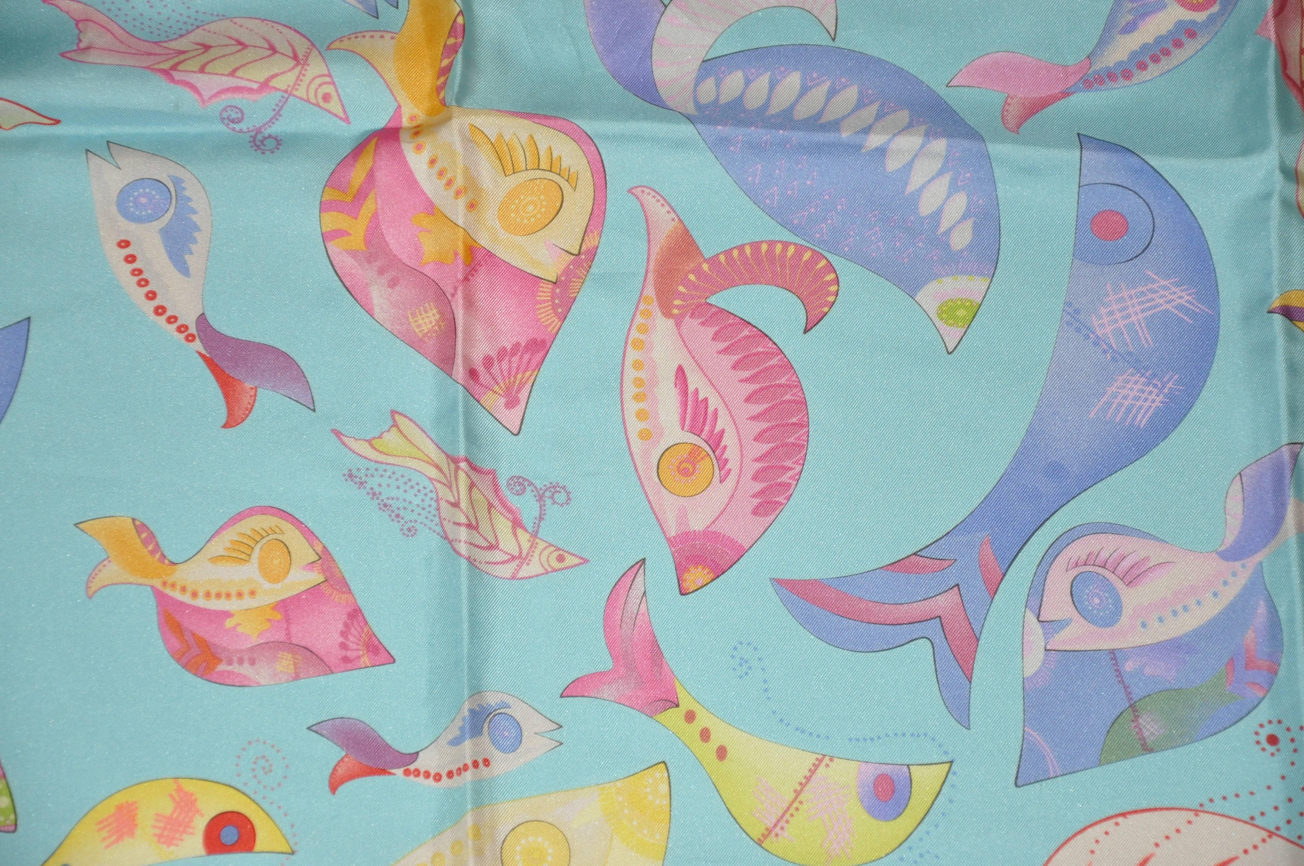 Salvatore Ferragamo wonderfully detailed "Creatures of the Sea" whimsical silk jacquard scarf measures 34" x 34" and finished with hand-rolled edges. Made in Italy.