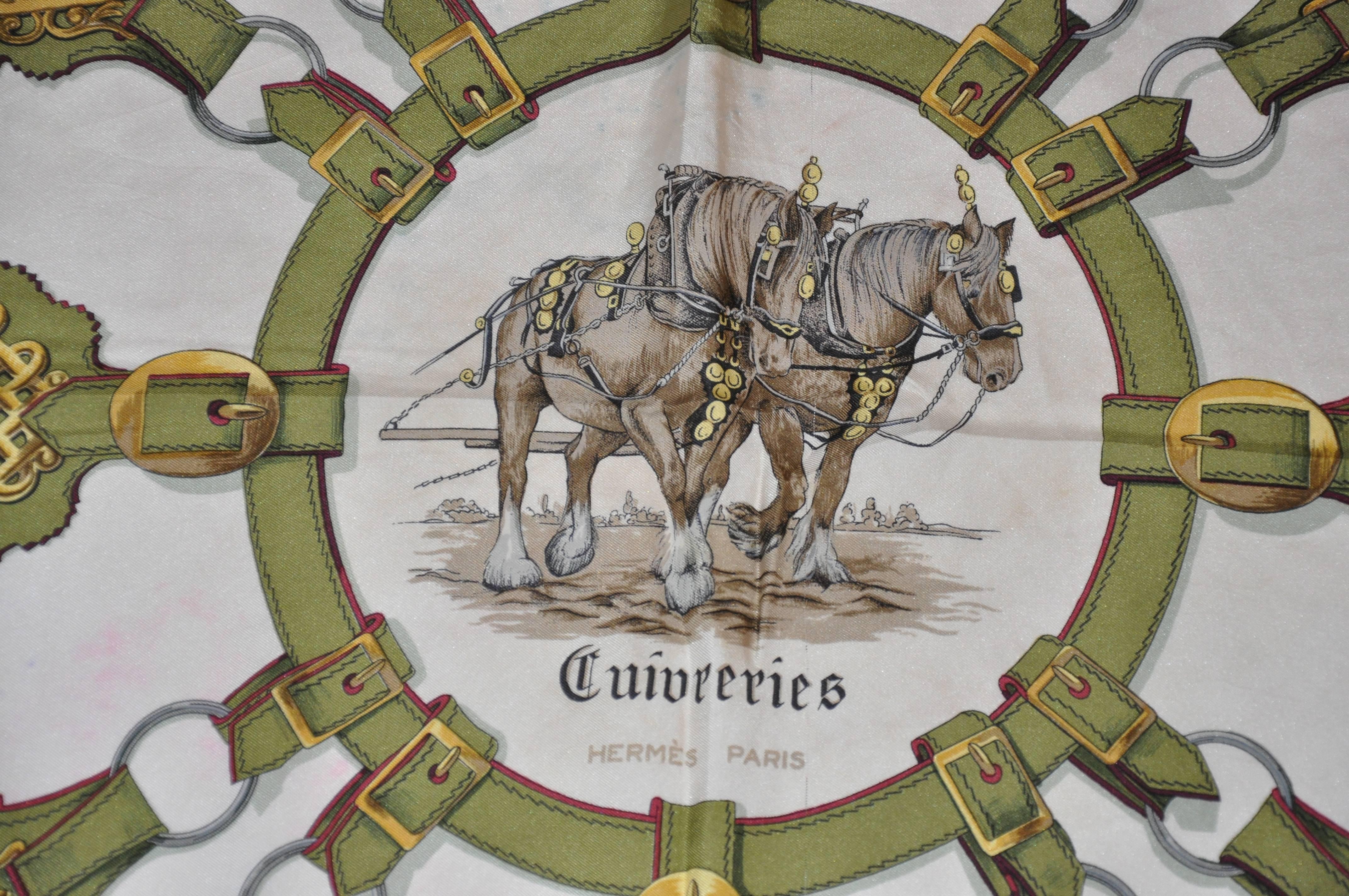 Hermes "Guivreries" designed by F. de la Perriere silk jacquard scarf measures 34" x 35" and finished with hand-rolled edges. Made in France. Condition is fair.