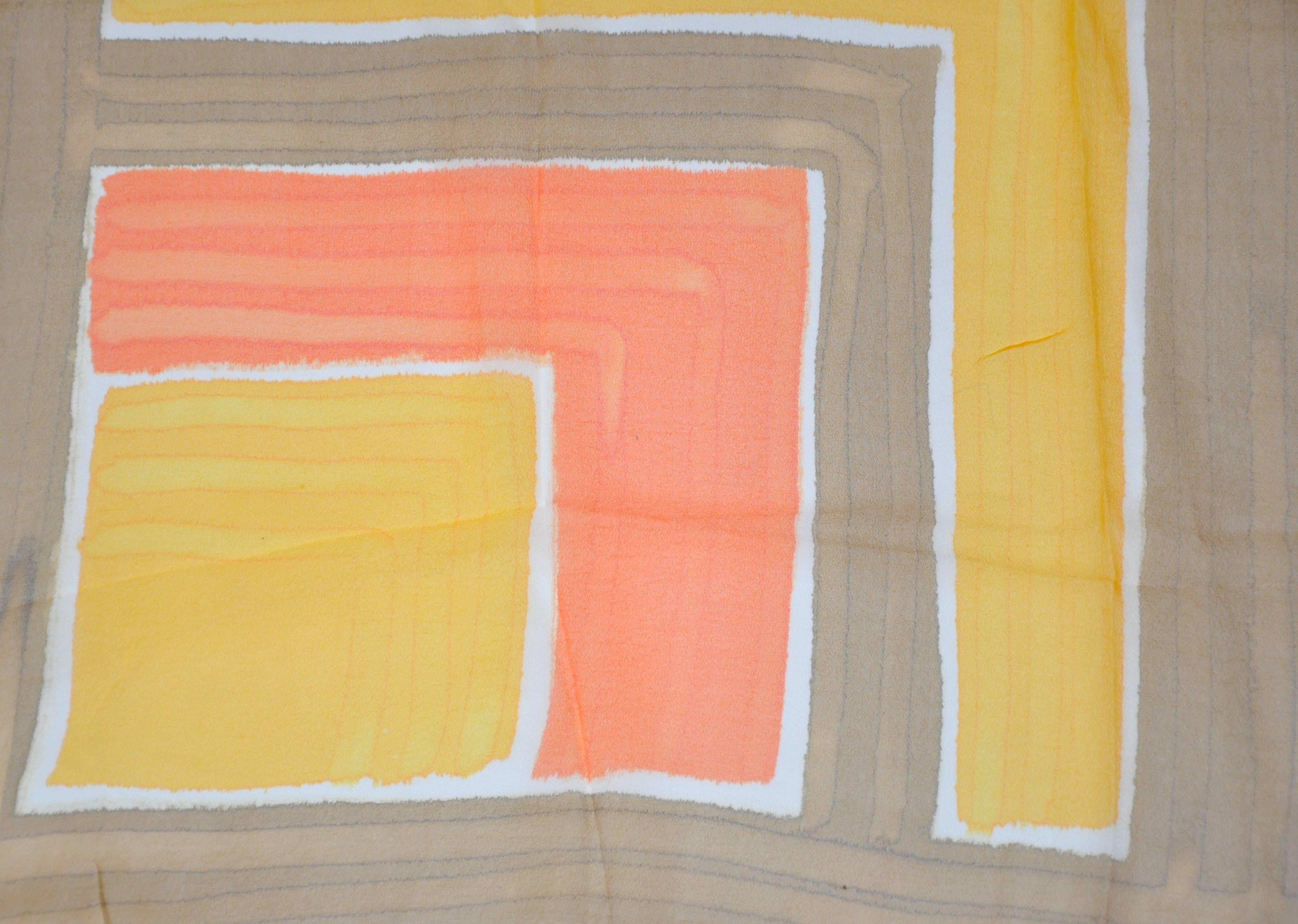 This wonderful sheer browns with tangerine & yellow color-block scarf measures 27" x 27". Made of 60% vinyl and 40% silk with hand-rolled edges. Made in Japan.